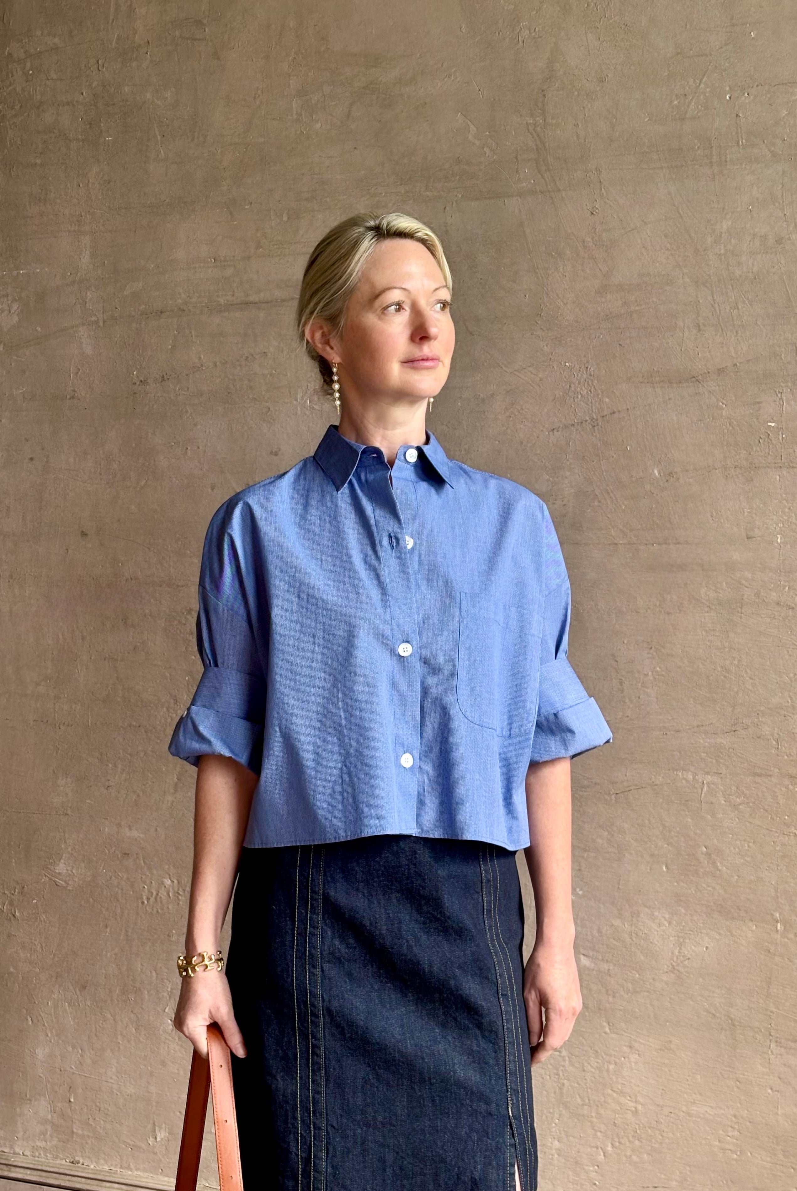 mature model wearing classic cotton poplin button down next ex top by luxury brand TWP in a blue and white