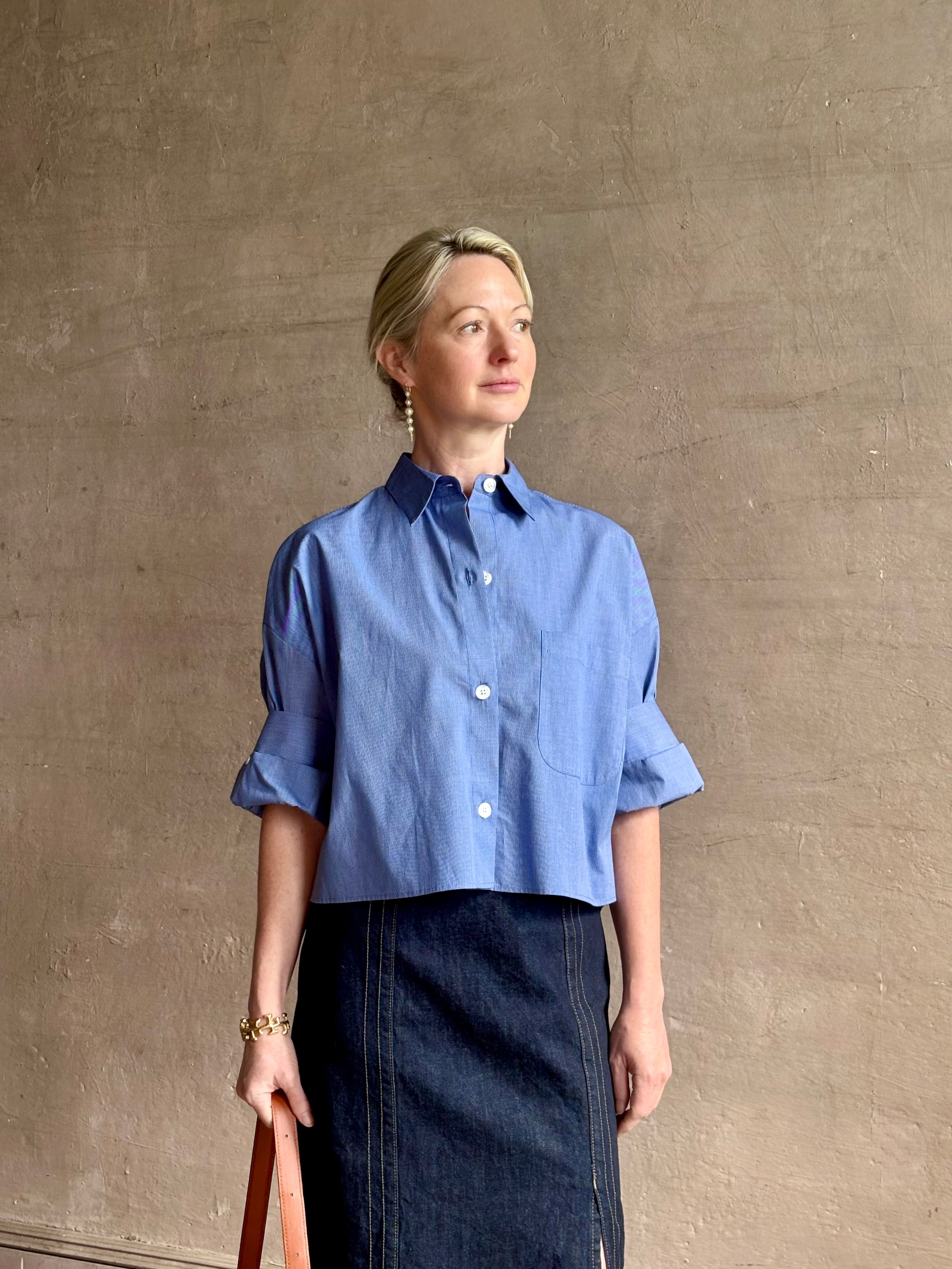 mature model wearing classic cotton poplin button down next ex top by luxury brand TWP in a blue and white