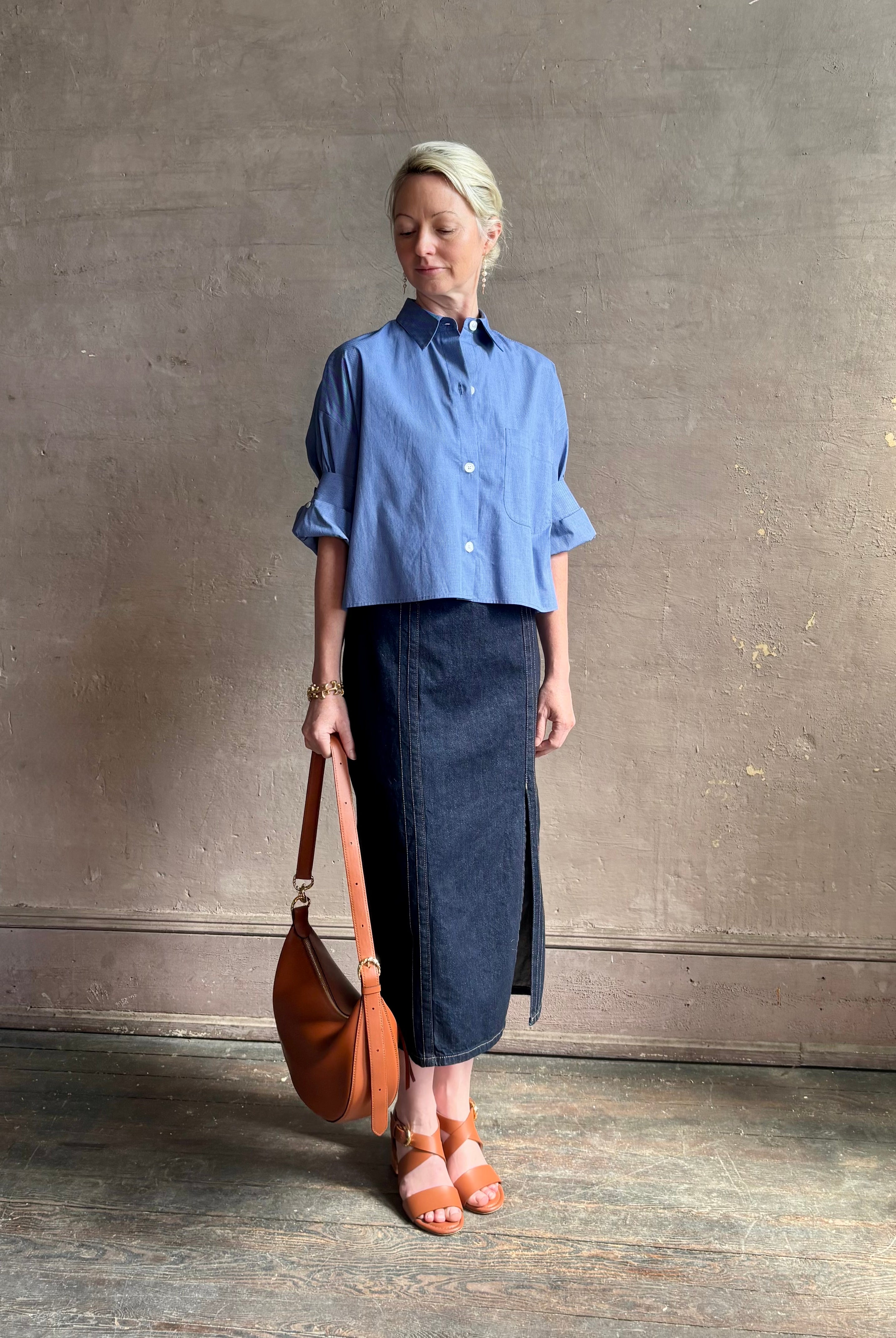 mature model wearing classic cotton poplin button down next ex top by luxury brand TWP in a blue and white