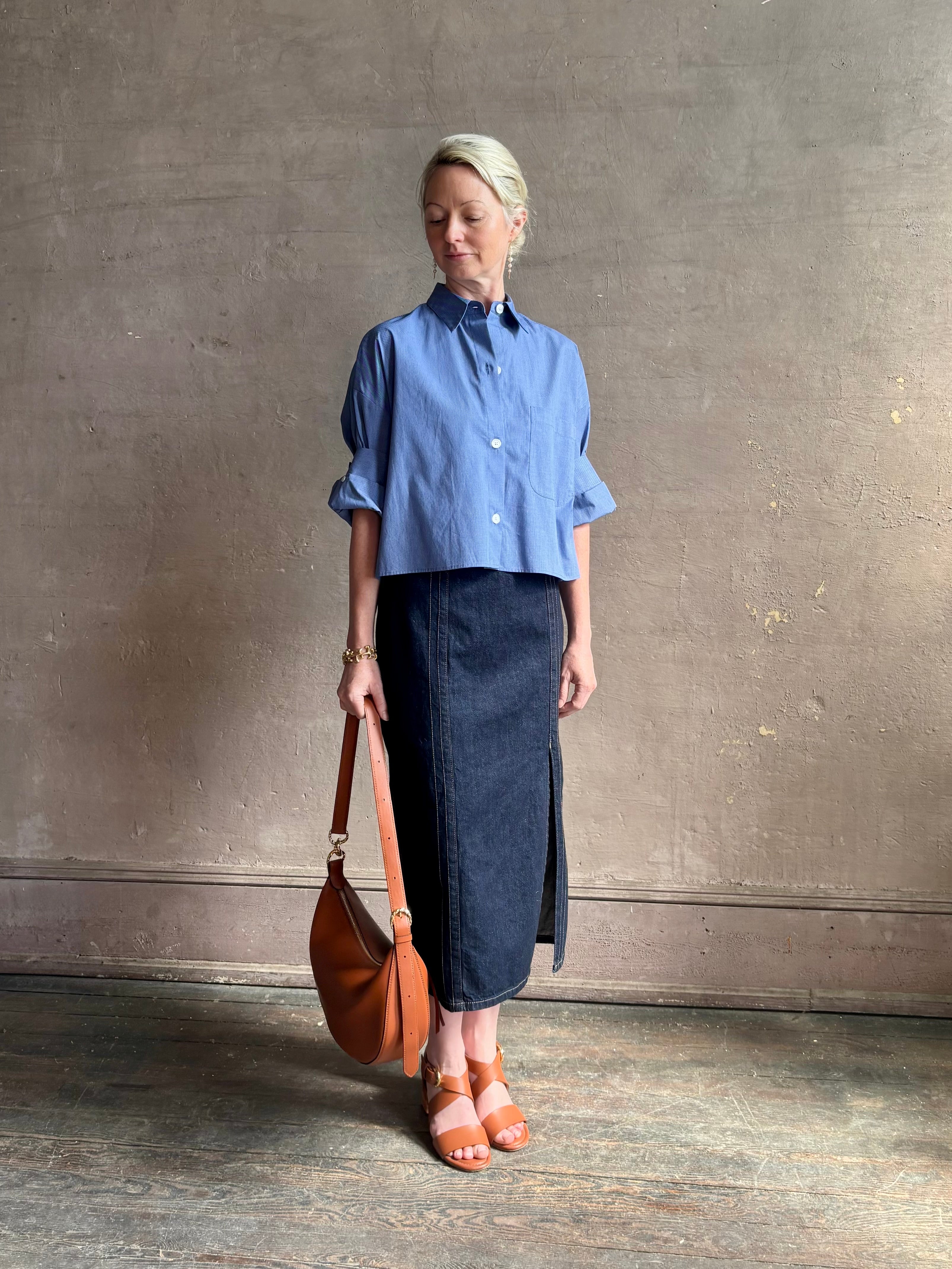 mature model wearing classic cotton poplin button down next ex top by luxury brand TWP in a blue and white