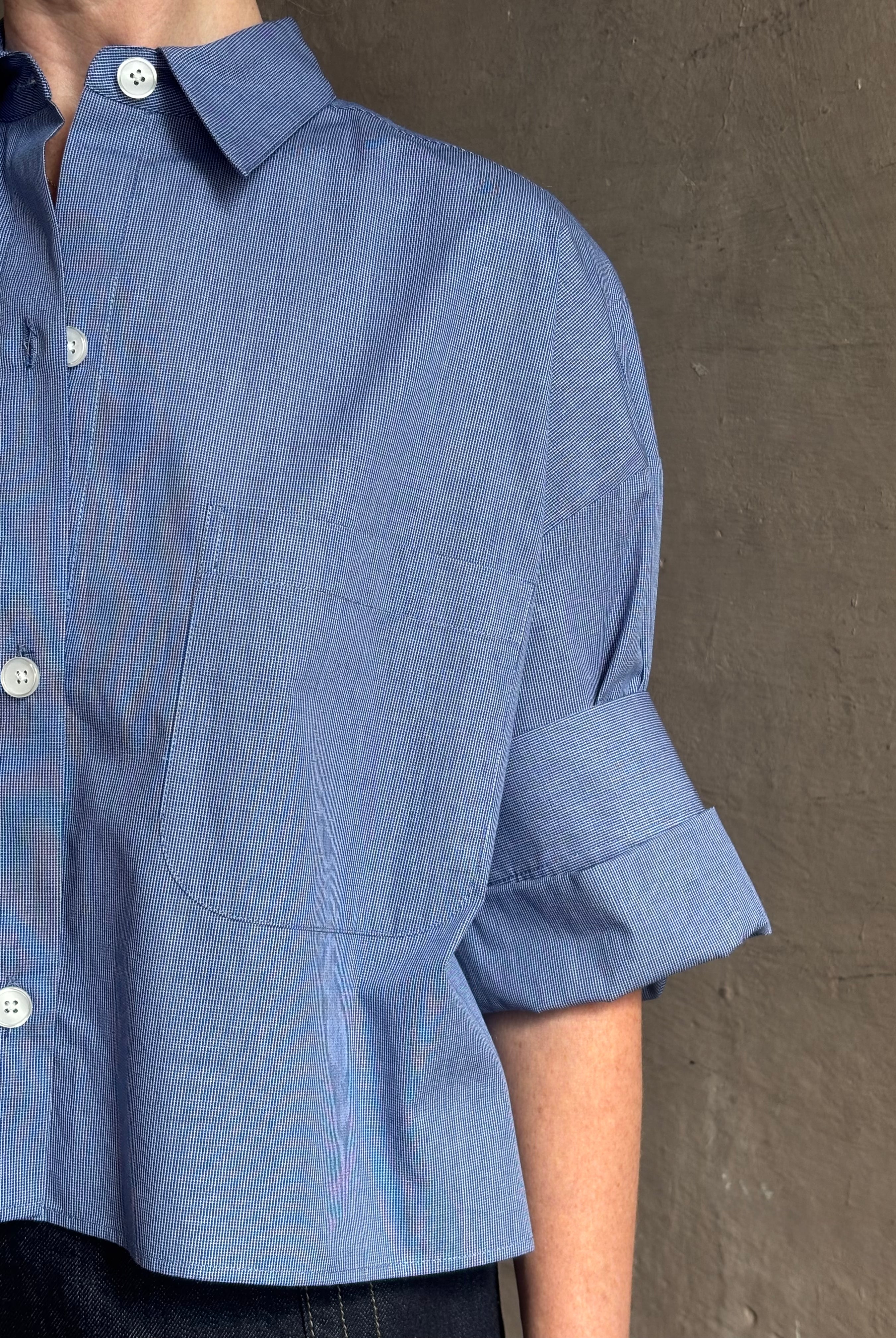 mature model wearing classic cotton poplin button down next ex top by luxury brand TWP in a blue and white