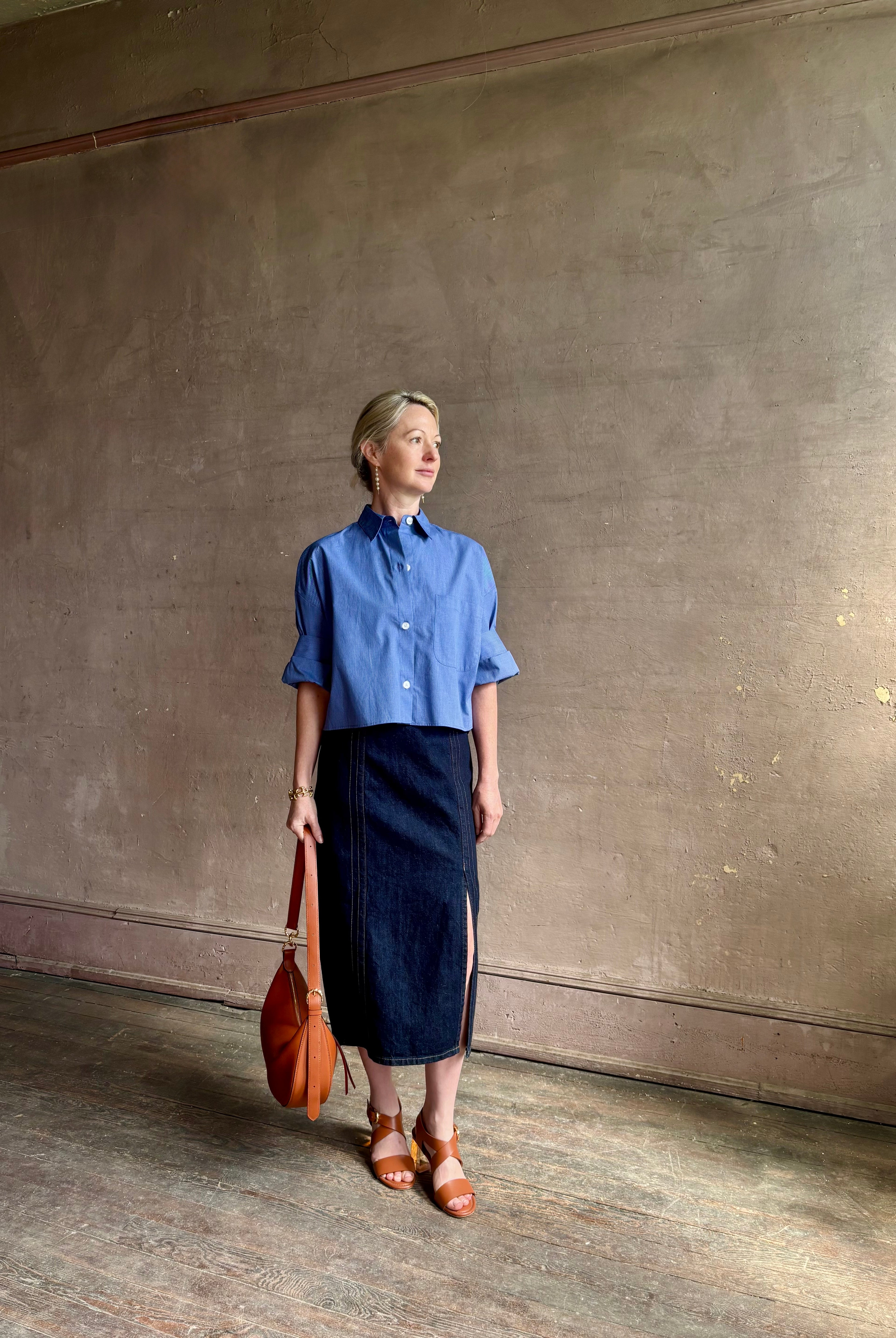 mature model wearing classic cotton poplin button down next ex top by luxury brand TWP in a blue and white