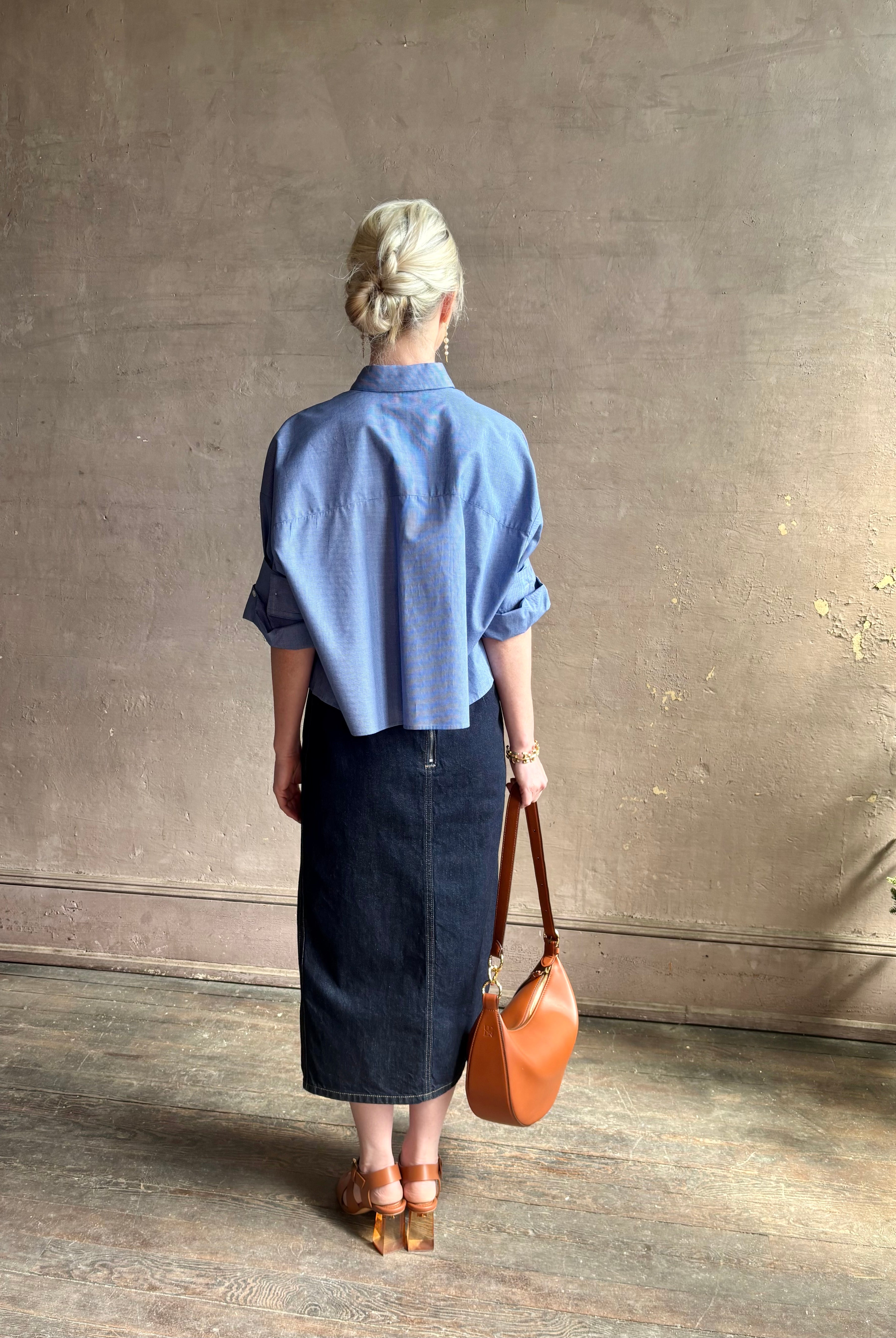 mature model wearing classic cotton poplin button down next ex top by luxury brand TWP in a blue and white