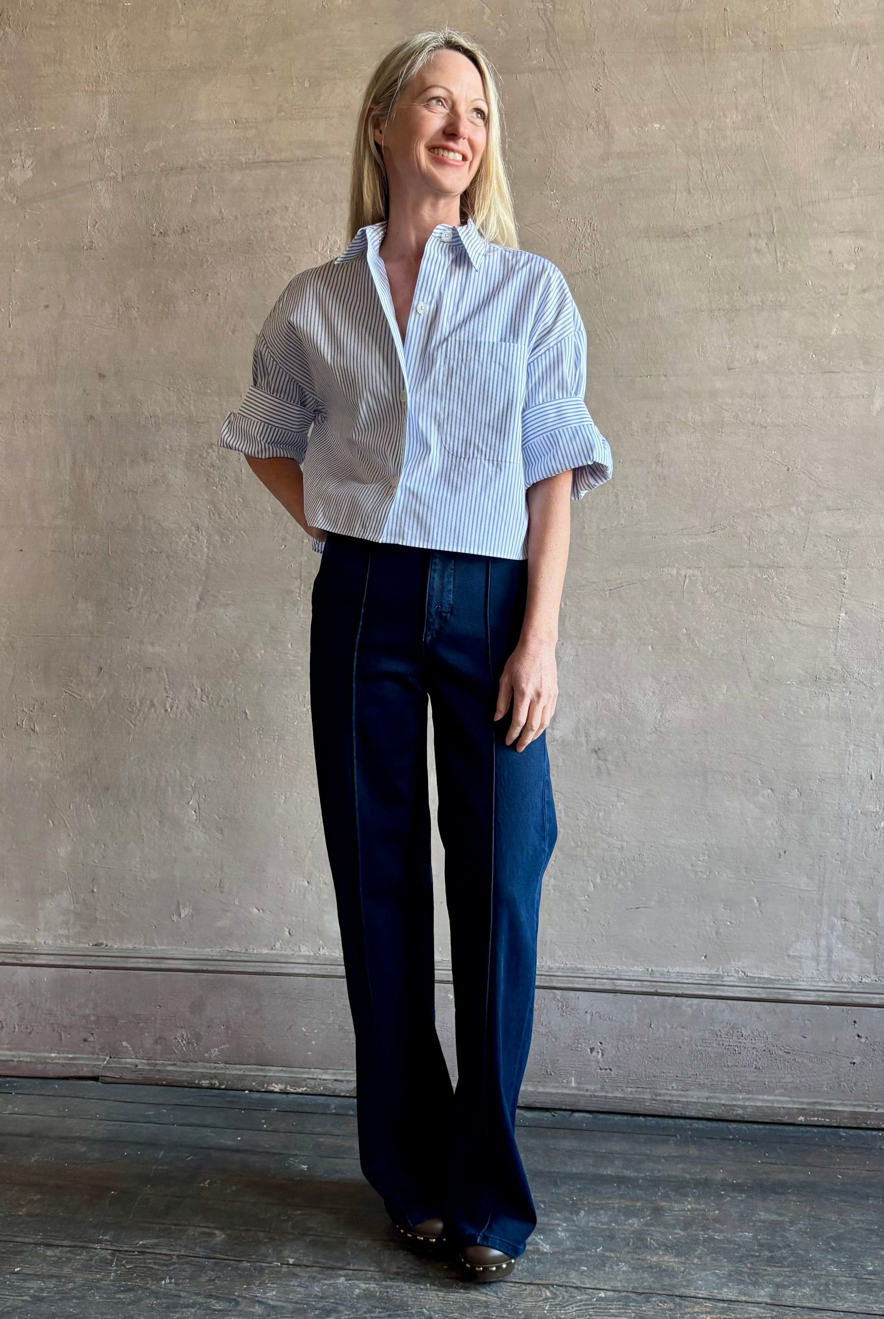 Woman wearing premium cotton poplin TWP Next EX Shirt in White and navy stripe with collar and button front made in USA