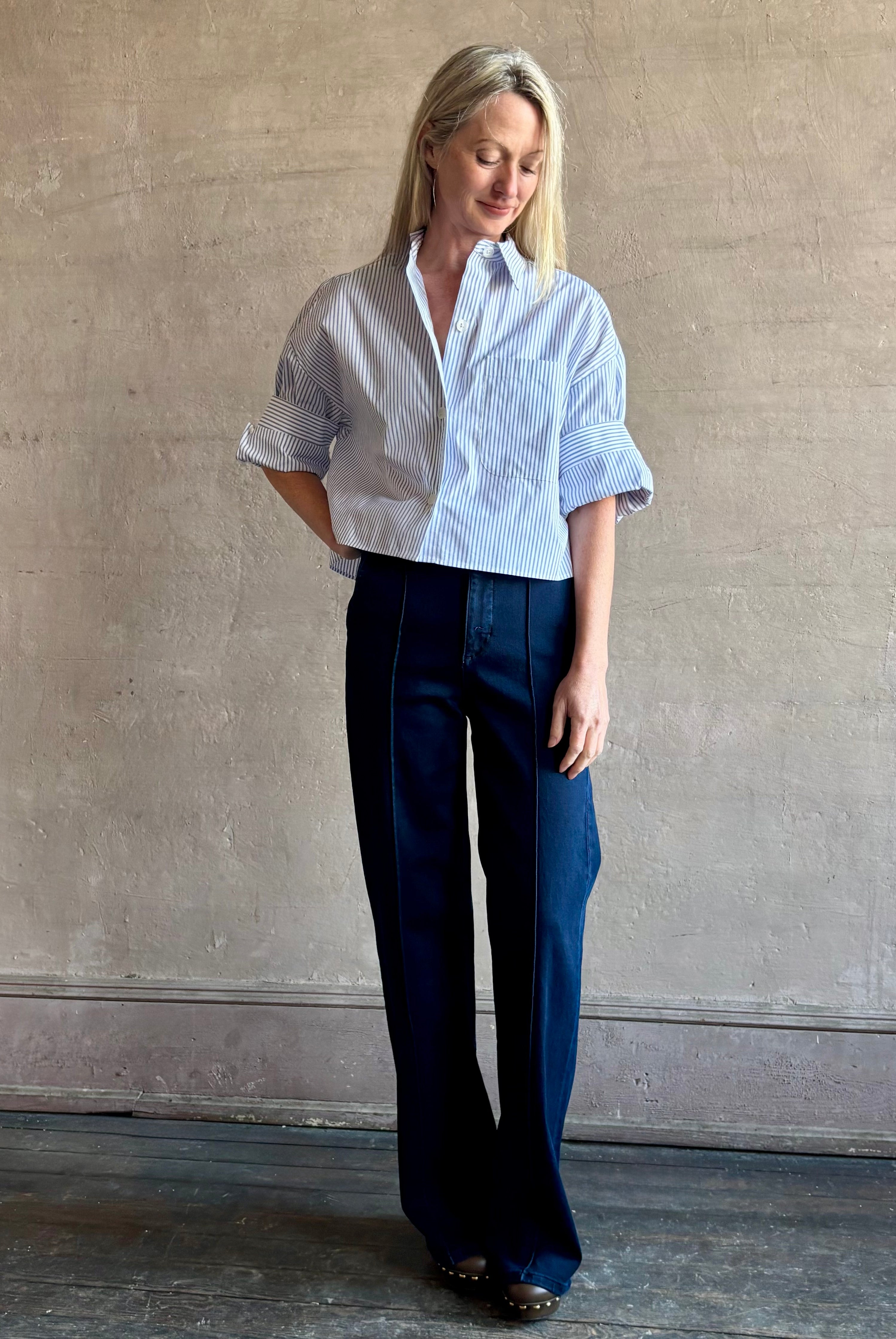 Woman wearing premium cotton poplin TWP Next EX Shirt in White and navy stripe with collar and button front made in USA