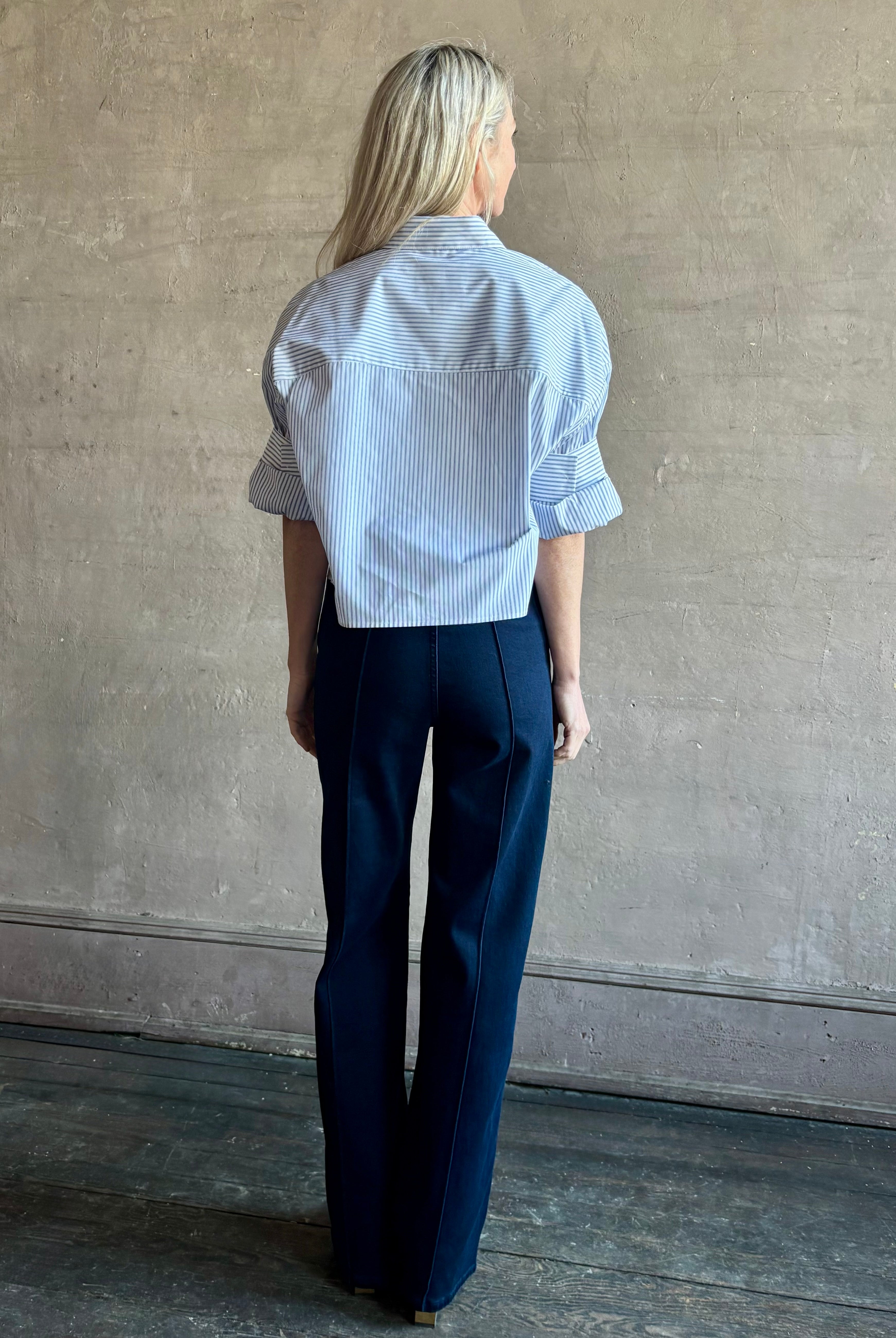 Woman wearing premium cotton poplin TWP Next EX Shirt in White and navy stripe with collar and button front made in USA