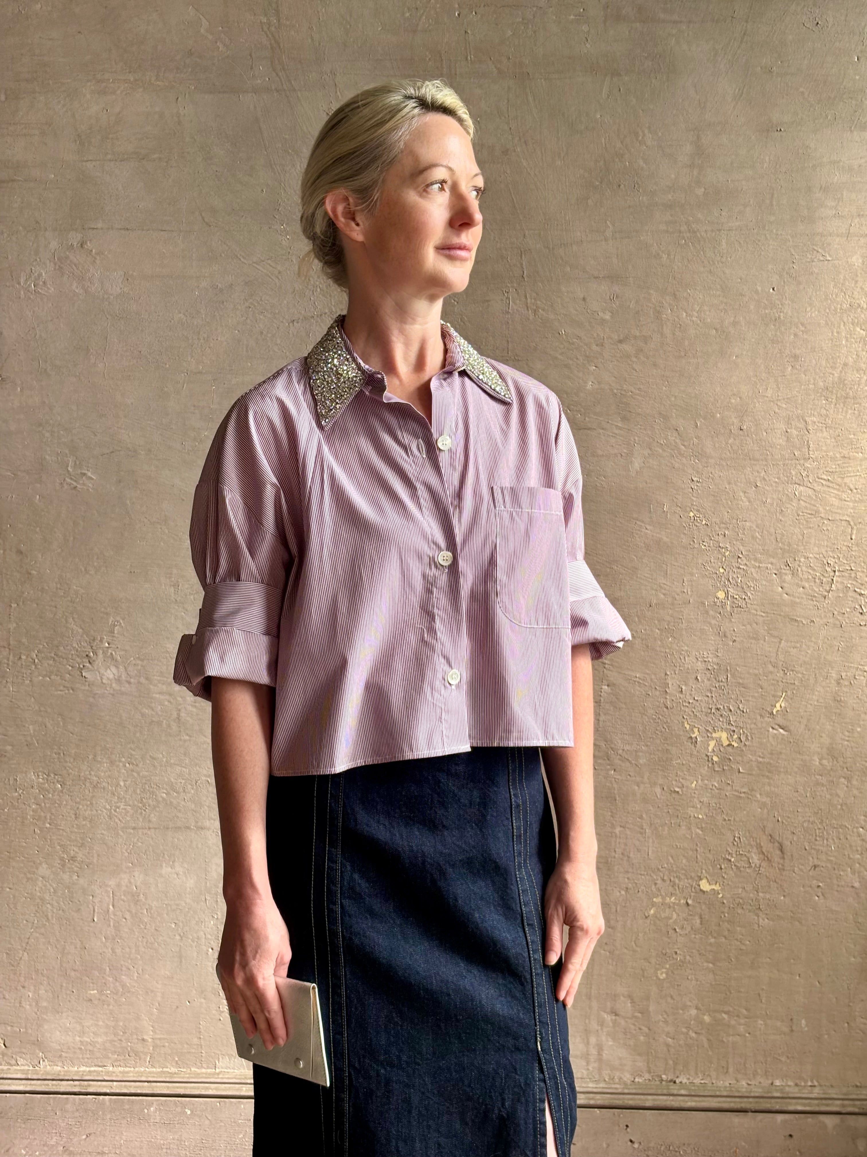 Image of mature woman wearing sophisticated TWP Next EX cotton shirt with elevated Crystal embellished Collar in White and wine stripe made in USA