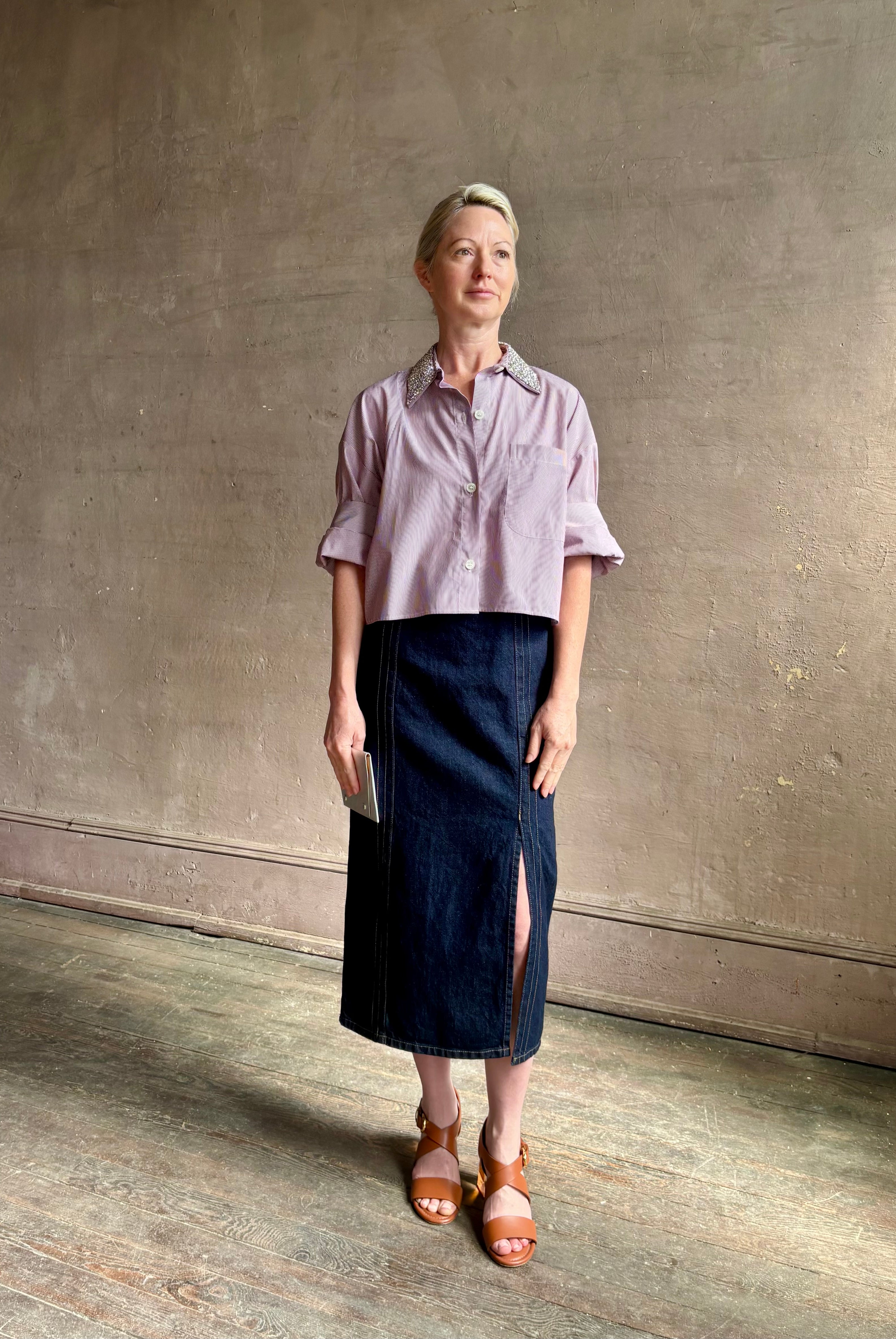 Image of mature woman wearing sophisticated TWP Next EX cotton shirt with elevated Crystal embellished Collar in White and wine stripe made in USA