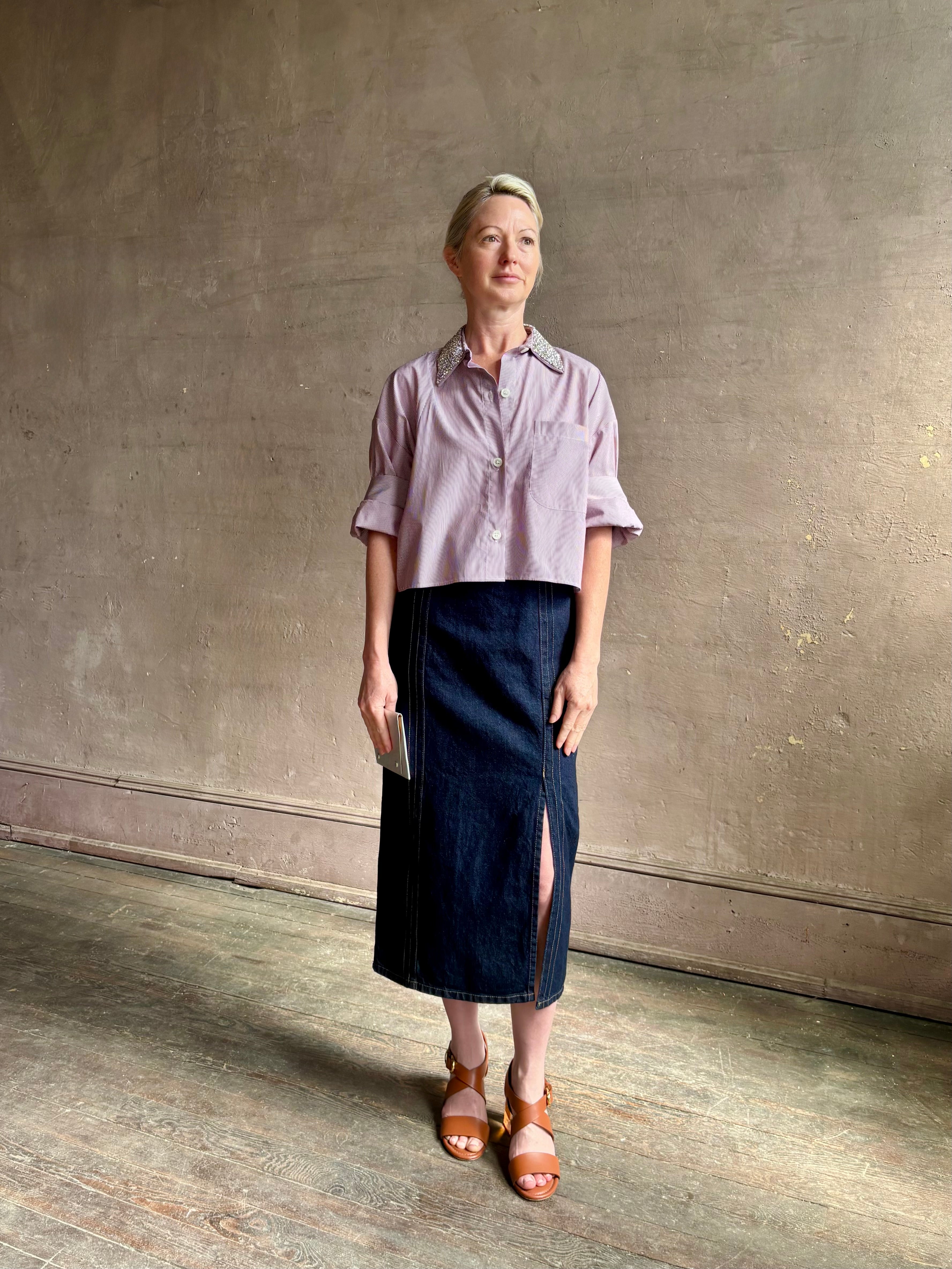 Image of mature woman wearing sophisticated TWP Next EX cotton shirt with elevated Crystal embellished Collar in White and wine stripe made in USA