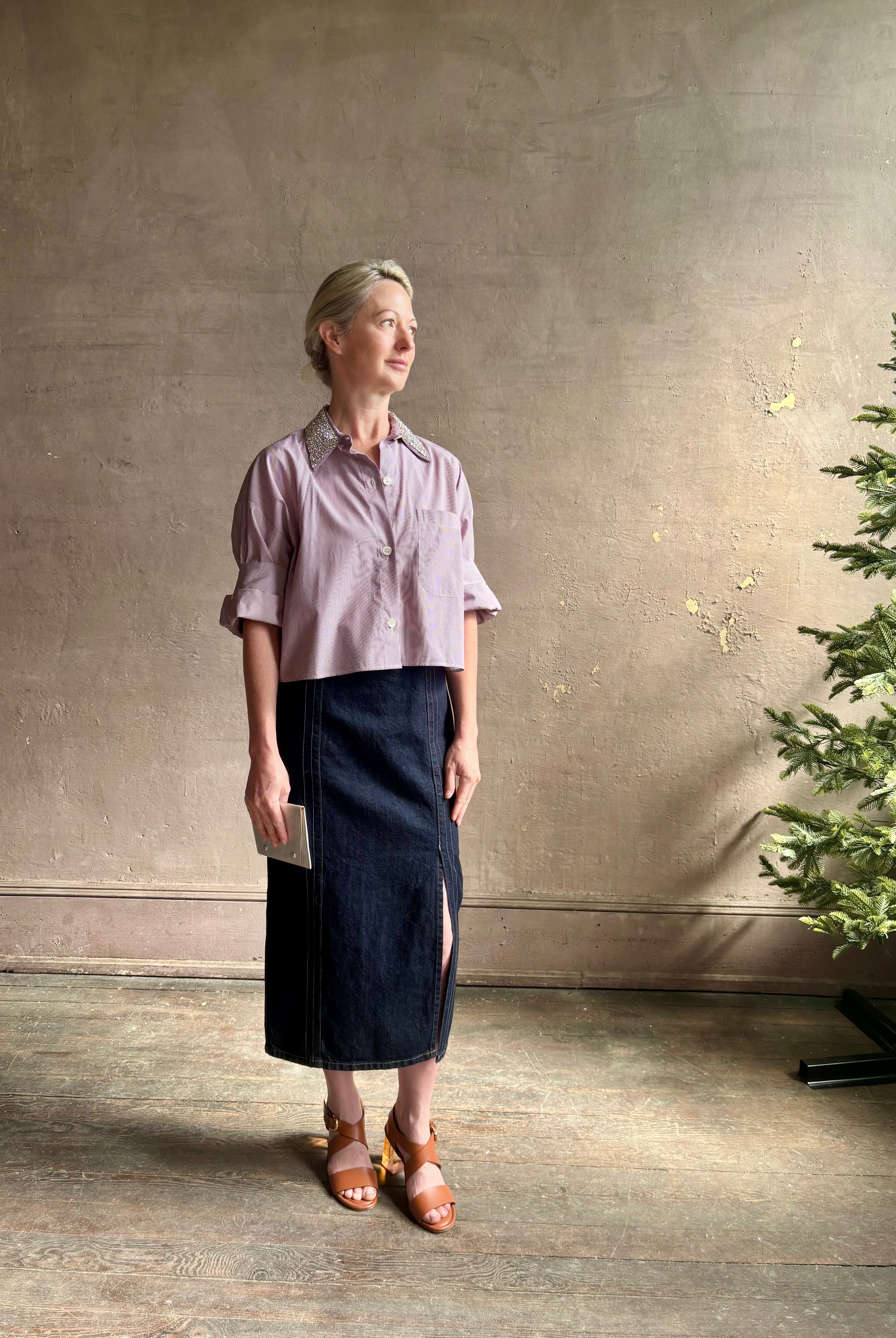 Image of mature woman wearing sophisticated TWP Next EX cotton shirt with elevated Crystal embellished Collar in White and wine stripe made in USA