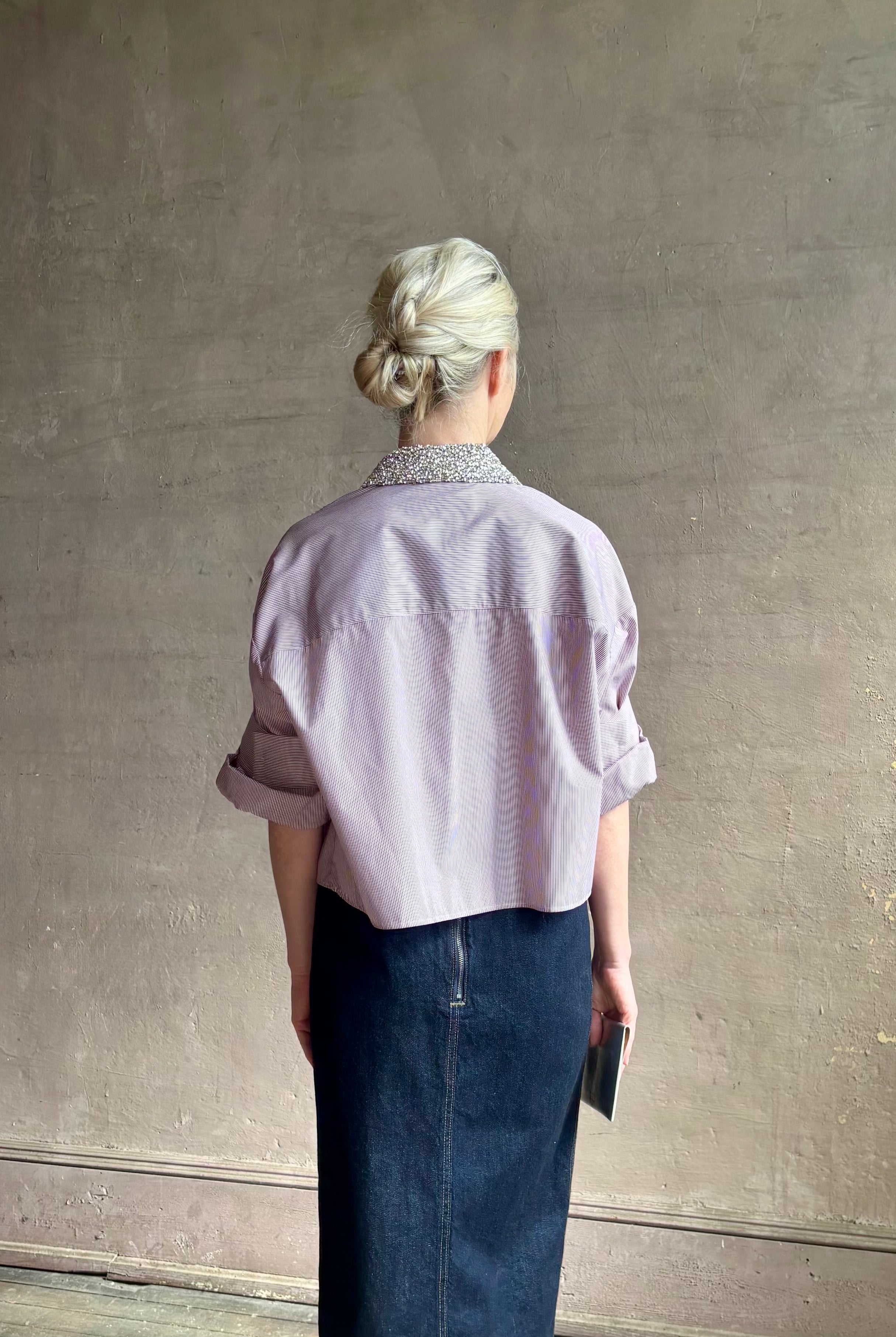 Image of mature woman wearing sophisticated TWP Next EX cotton shirt with elevated Crystal embellished Collar in White and wine stripe made in USA
