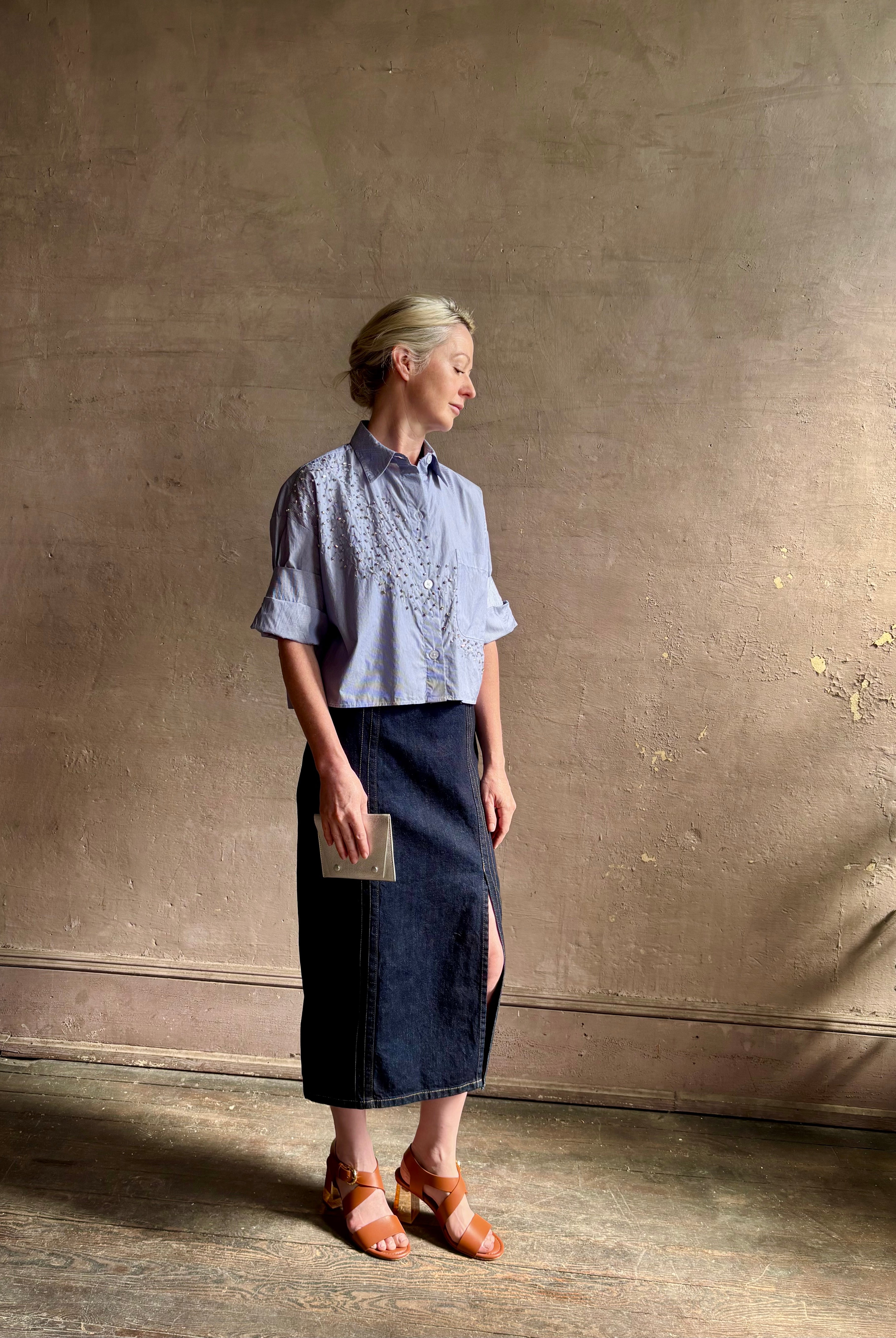 Mature woman wearing premium cotton TWP Next EX Crystal-Embellished blue and white striped Shirt with button front, collar and signature tailored cuffed sleeve detail