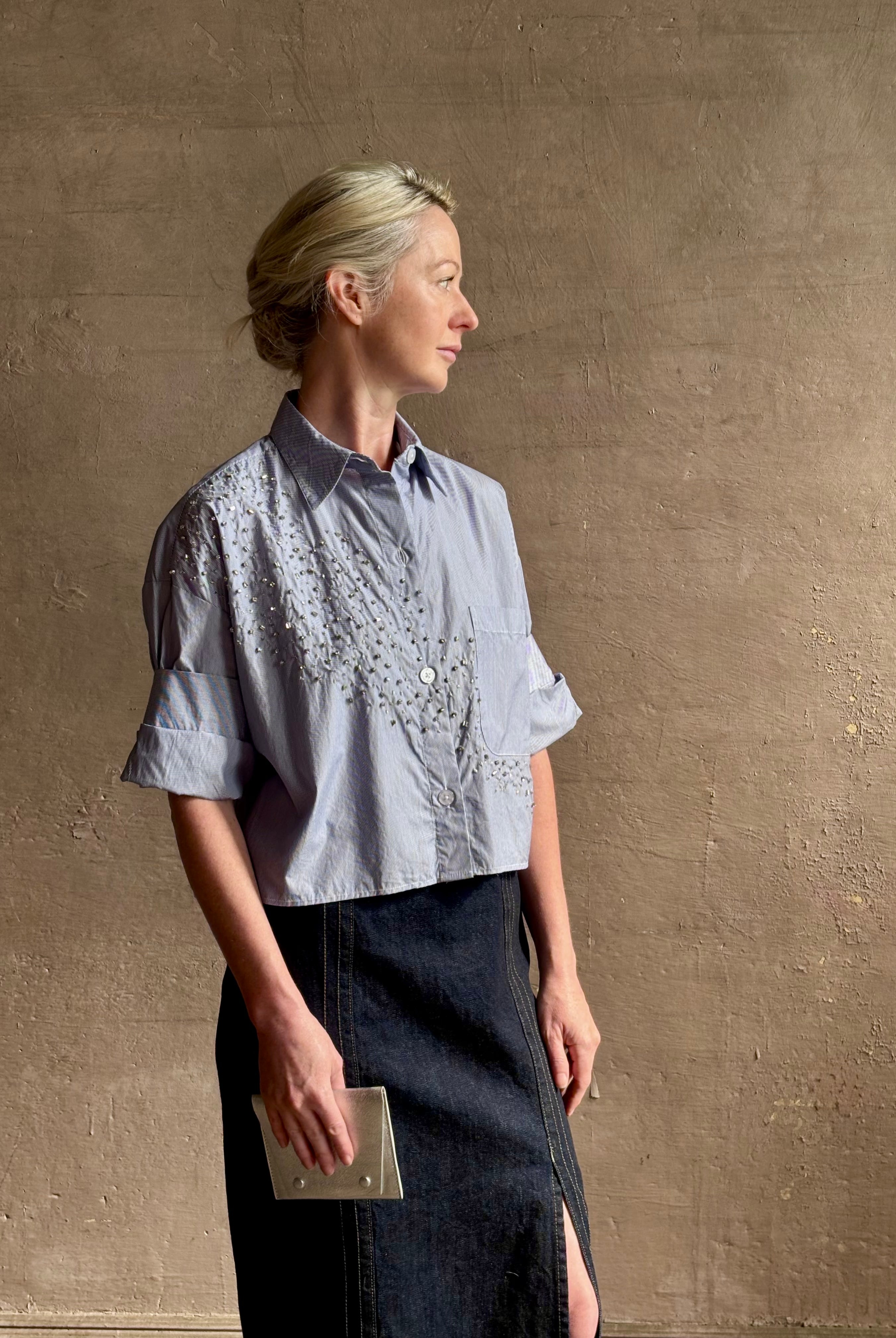Mature woman wearing premium cotton TWP Next EX Crystal-Embellished blue and white striped Shirt with button front, collar and signature tailored cuffed sleeve detail