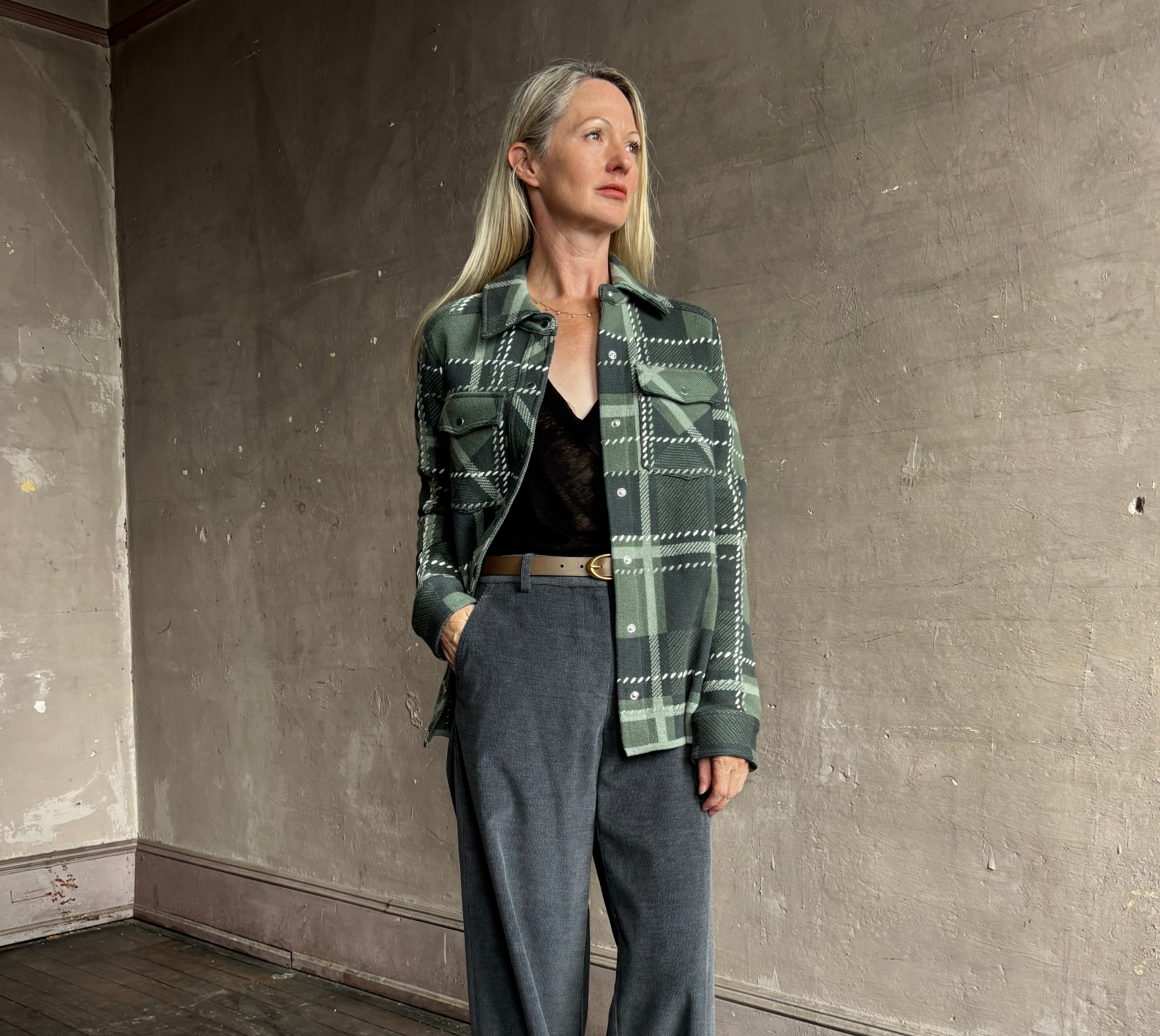 Image of mature woman wearing TWP ranchers cardigan with mountain-inspired comfort.