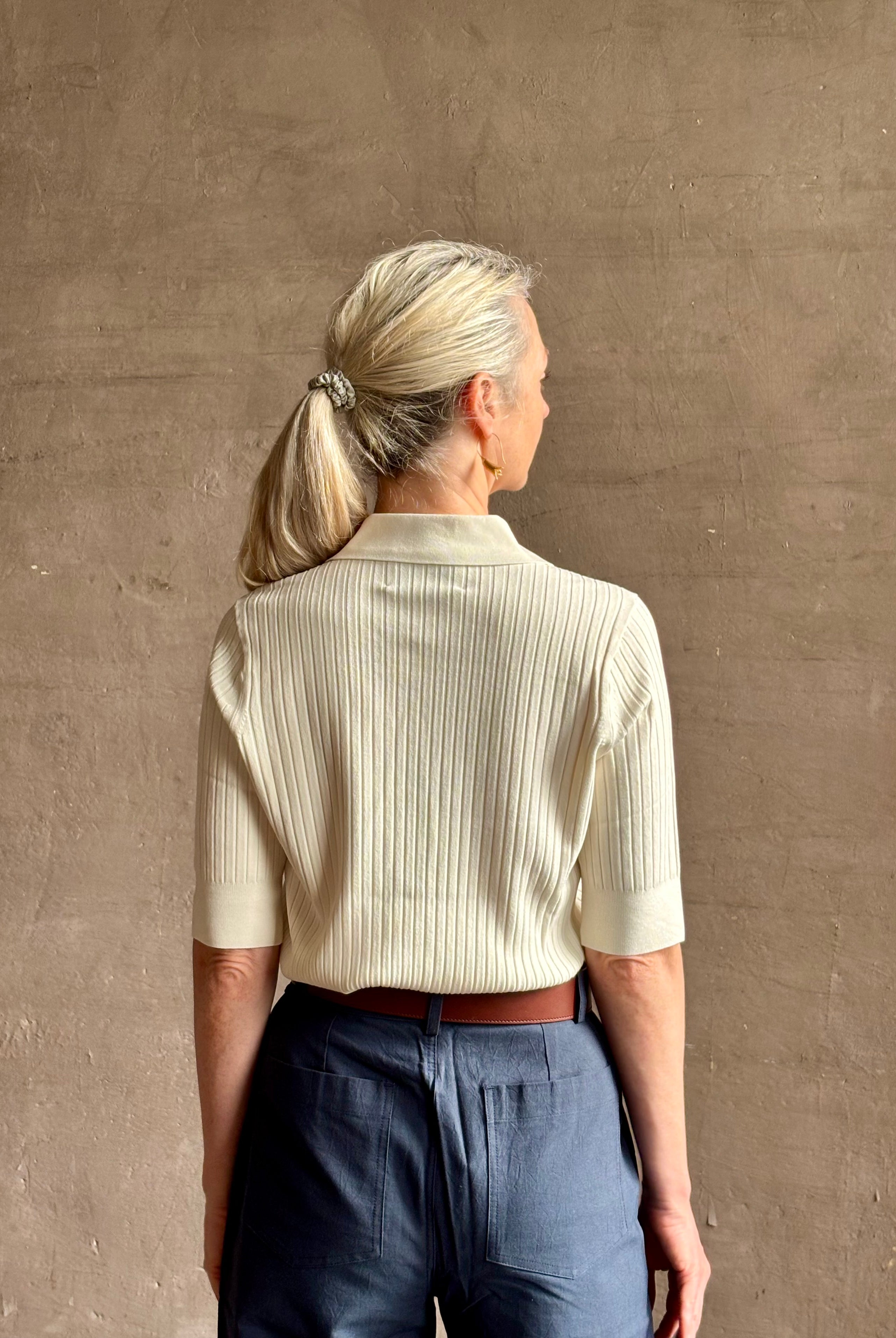 mature woman wearing quality TWP ivory short sleeve knit polo top ribbed texture collar henley