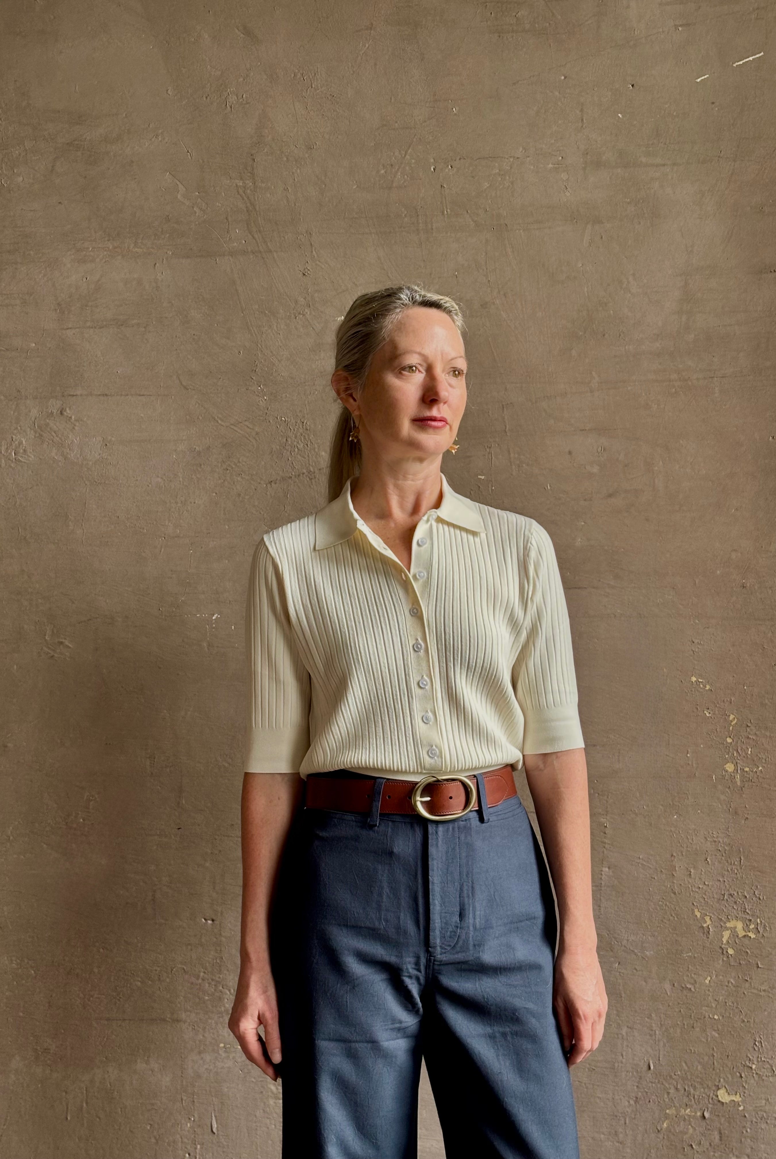 mature woman wearing quality TWP ivory short sleeve knit polo top ribbed texture collar henley