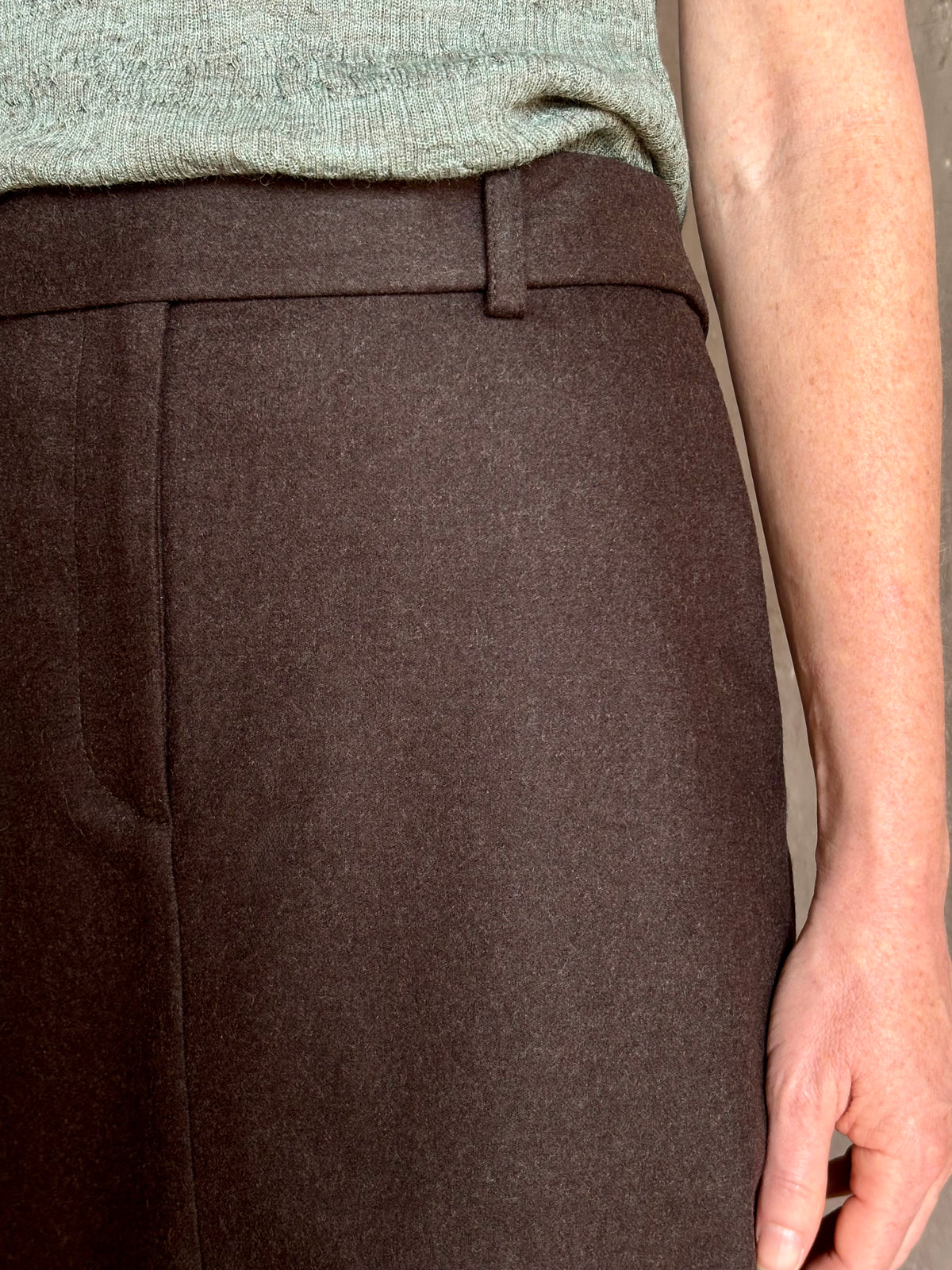 Mature woman wearing elegant TWP slit pencil skirt wool chocolate brown elevated tailored maxi skirt
