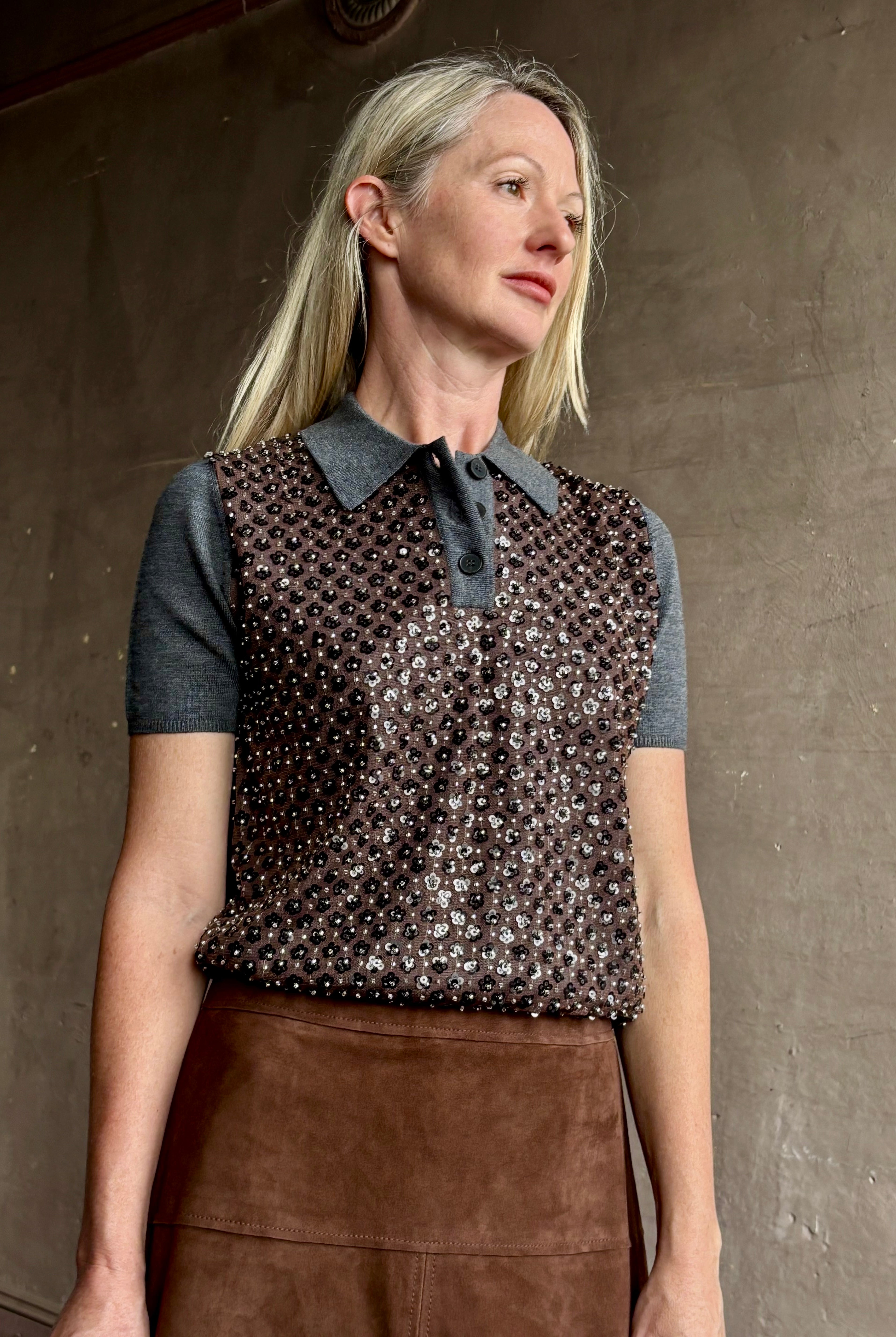 Image of woman wearing Tanya Taylor Camilla Knit top with a brown sequin floral patterned over a gray extra fine merino wool polo sweater