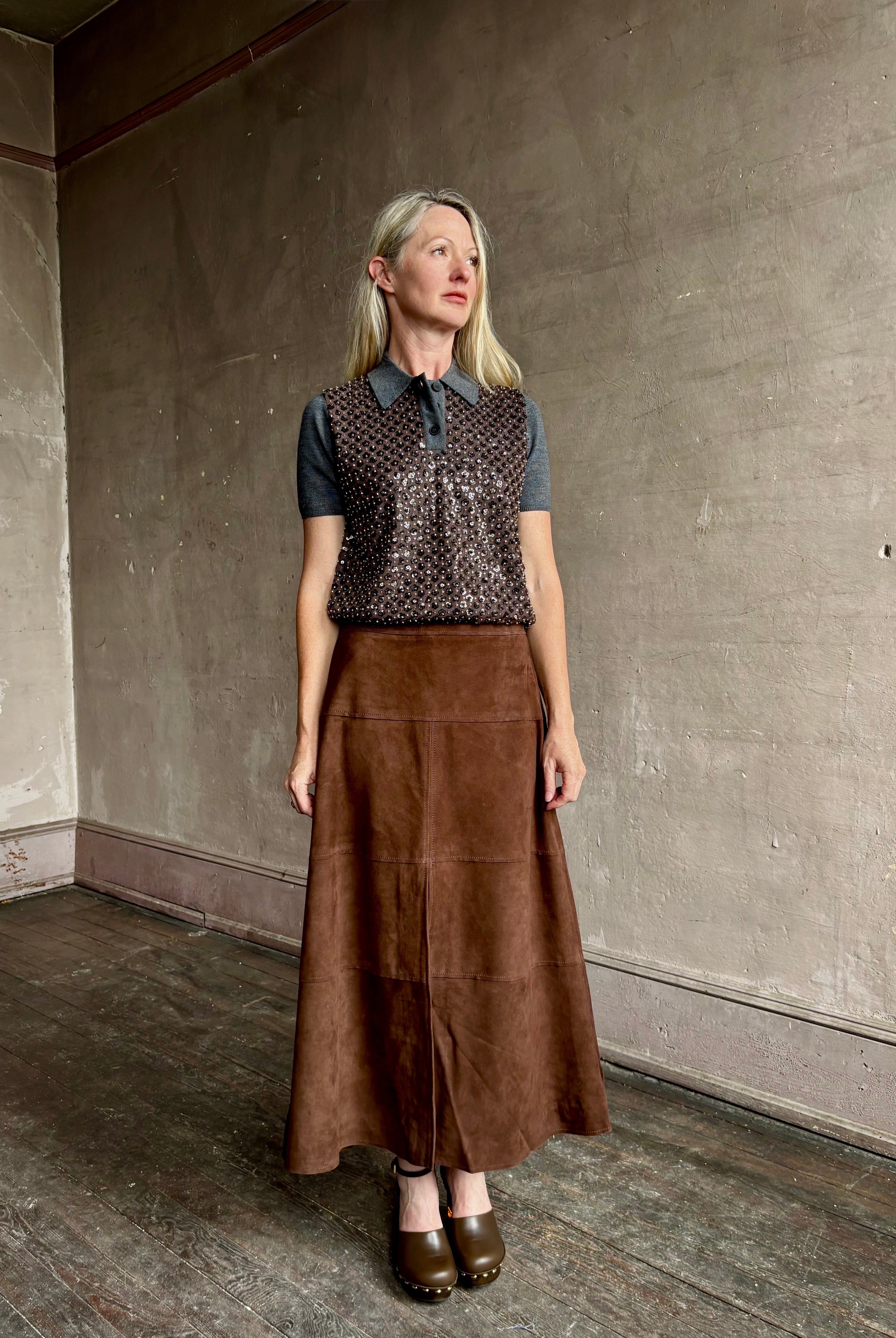 Image of woman wearing Tanya Taylor Camilla Knit top with a brown sequin floral patterned over a gray extra fine merino wool polo sweater