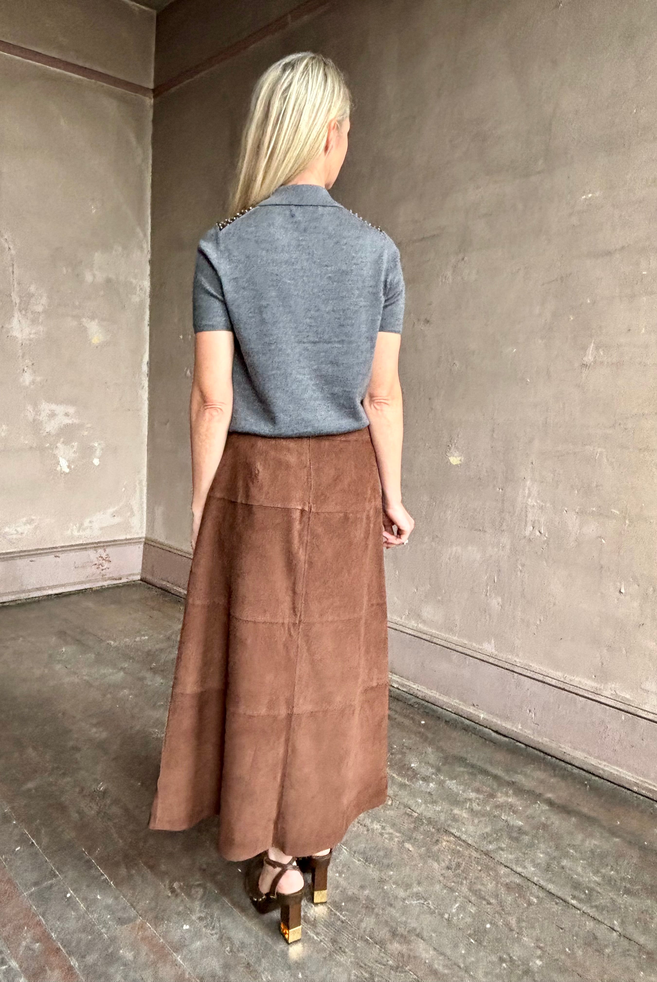 Image of woman wearing Tanya Taylor Camilla Knit top with a brown sequin floral patterned over a gray extra fine merino wool polo sweater