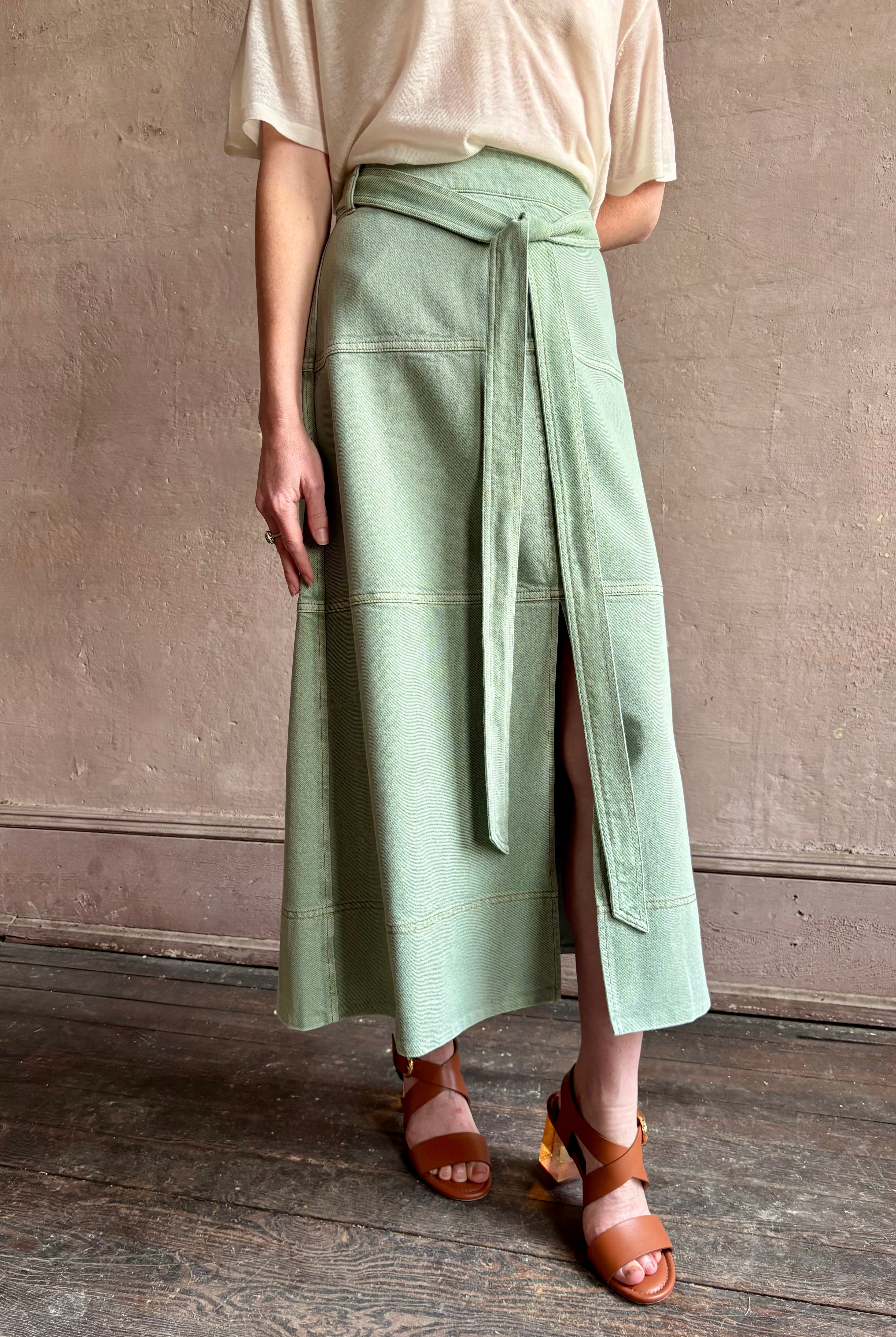 Mature woman wearing premium designer Tanya Taylor Hudley timeless cotton maxi A-line Skirt in Pistachio green