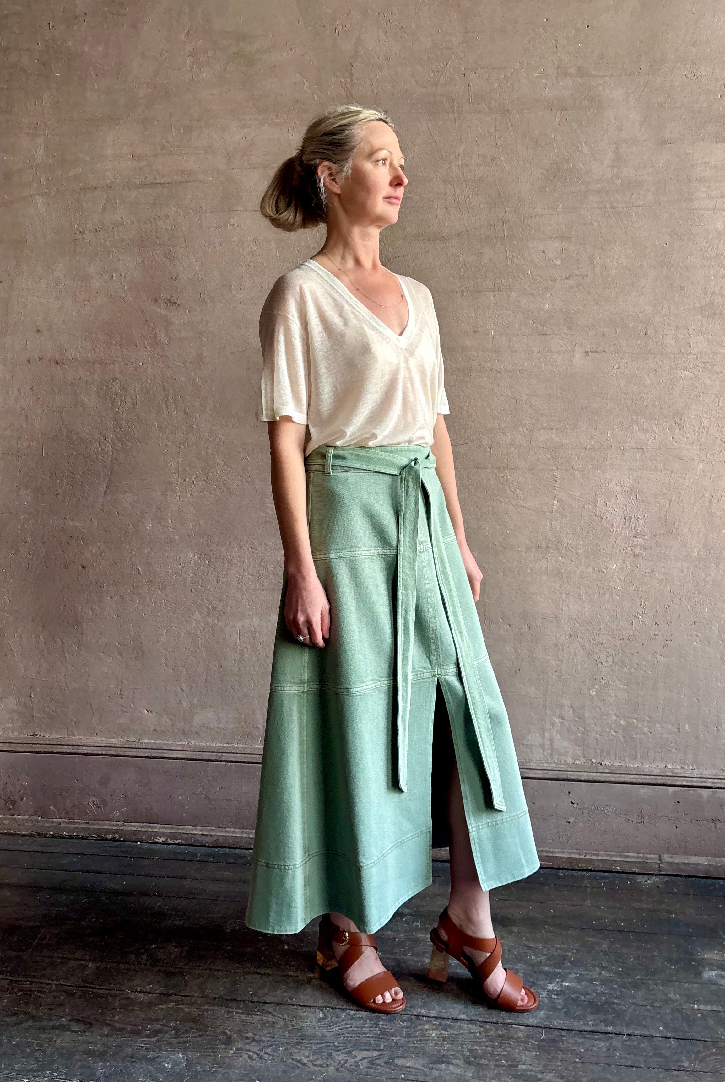 Mature woman wearing premium designer Tanya Taylor Hudley lightweight cotton maxi A-line Skirt in Pistachio green