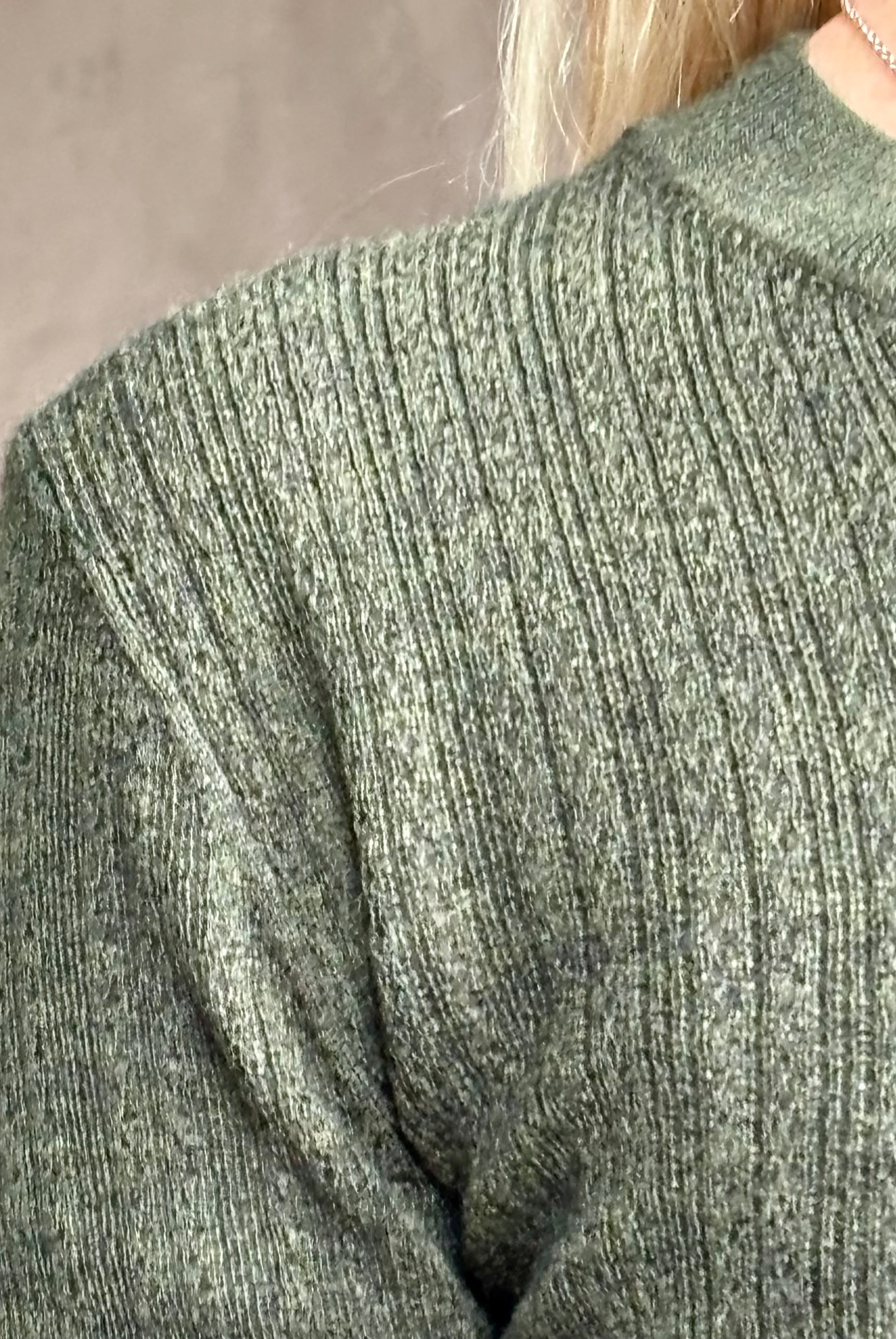 Close up image of designer TANYA TAYLOR Crew Neck Kayden merino wool Knit Top in sophisticated heathered Green