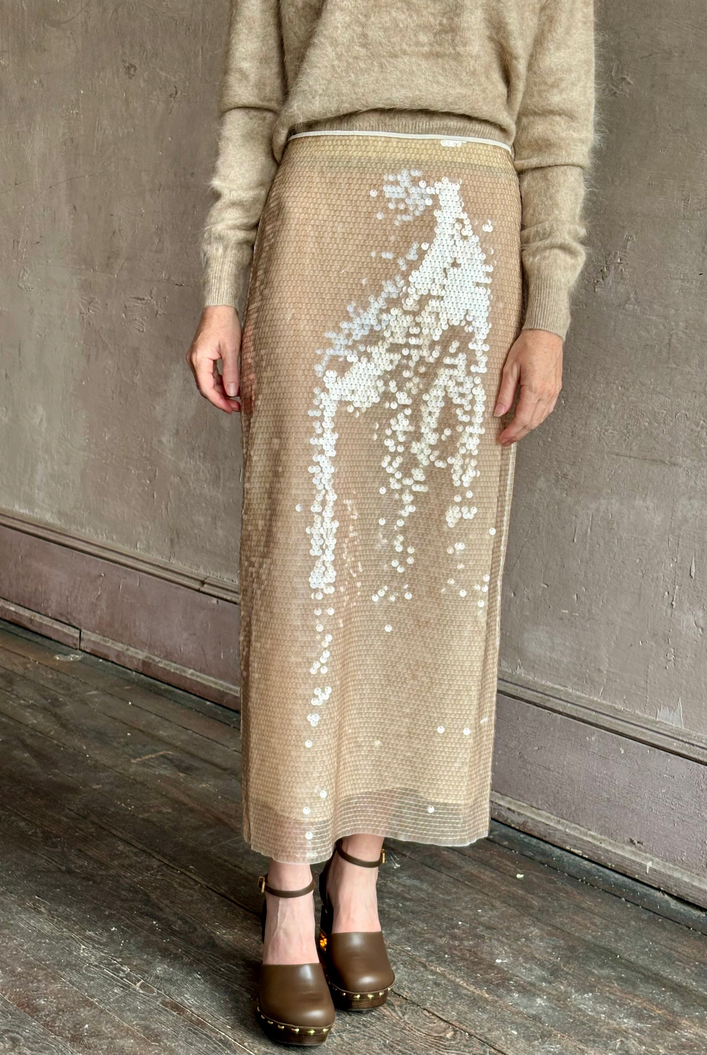 Image of mature woman wearing designer Tanya Taylor Kiah sequin maxi-length pencil skirt with flattering fit and in a neutral beige colorway