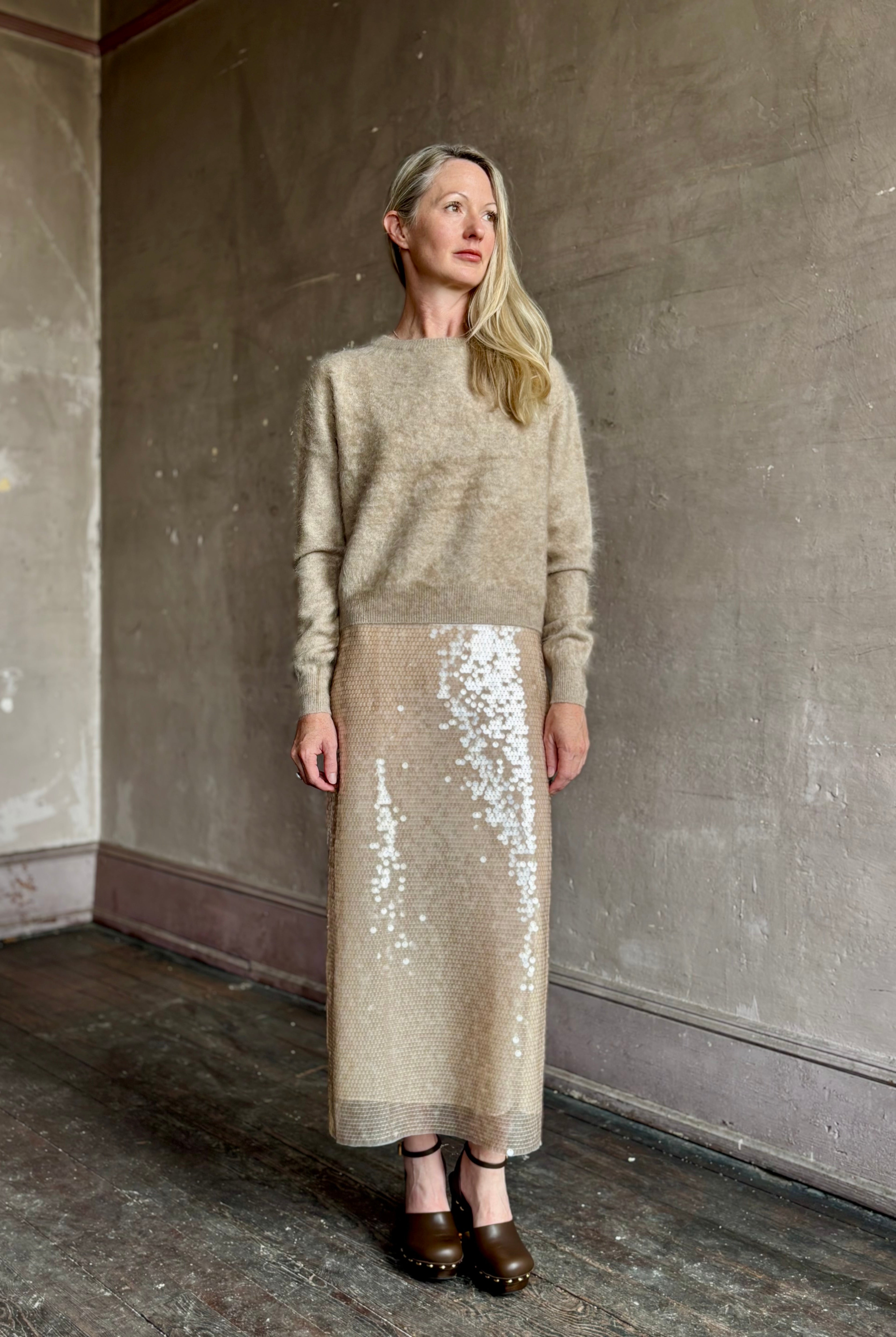 Image of mature woman wearing designer Tanya Taylor Kiah sequin maxi-length pencil skirt with flattering fit and in a neutral beige colorway