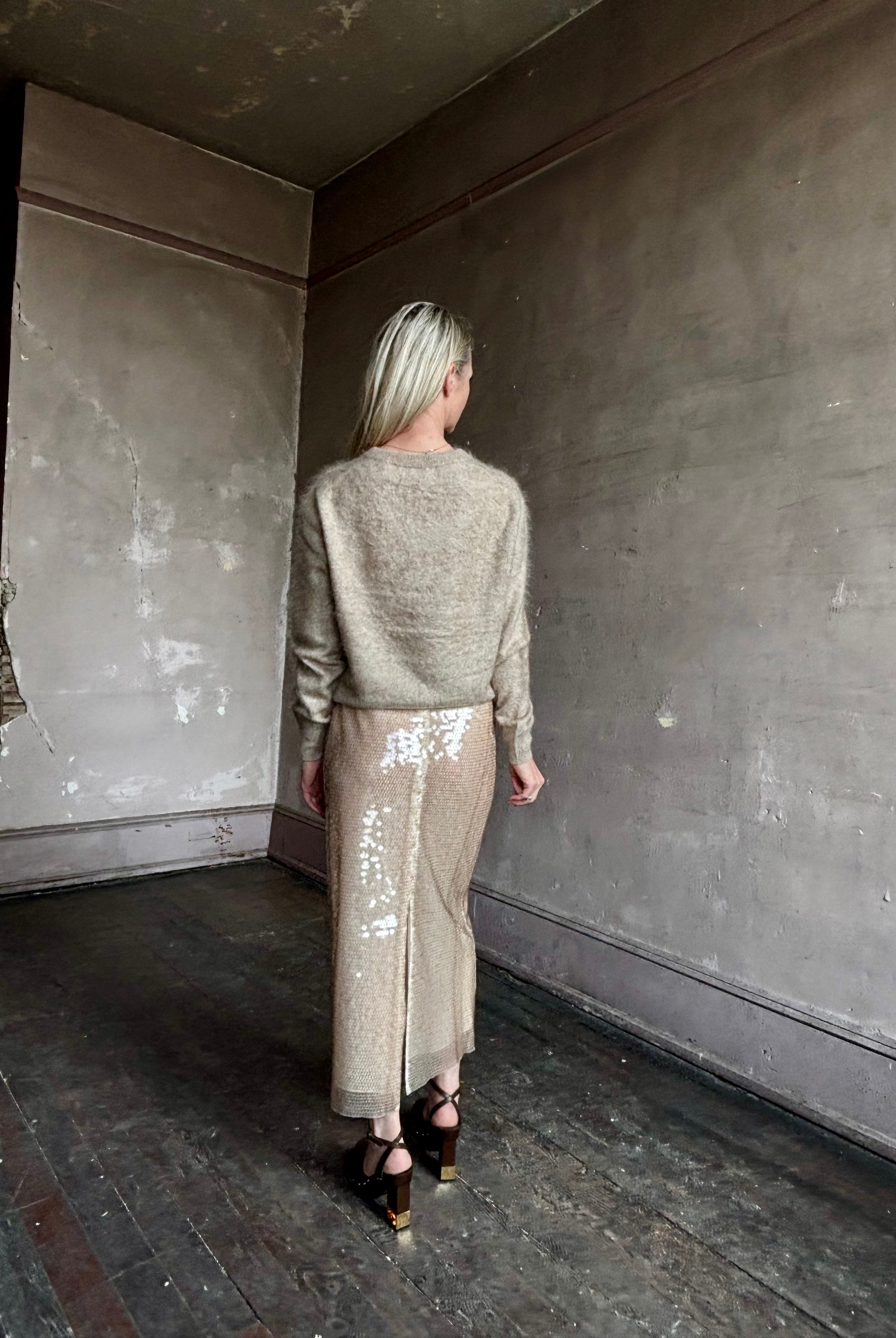 Image of mature woman wearing designer Tanya Taylor Kiah sequin maxi-length pencil skirt with flattering fit and in a neutral beige colorway