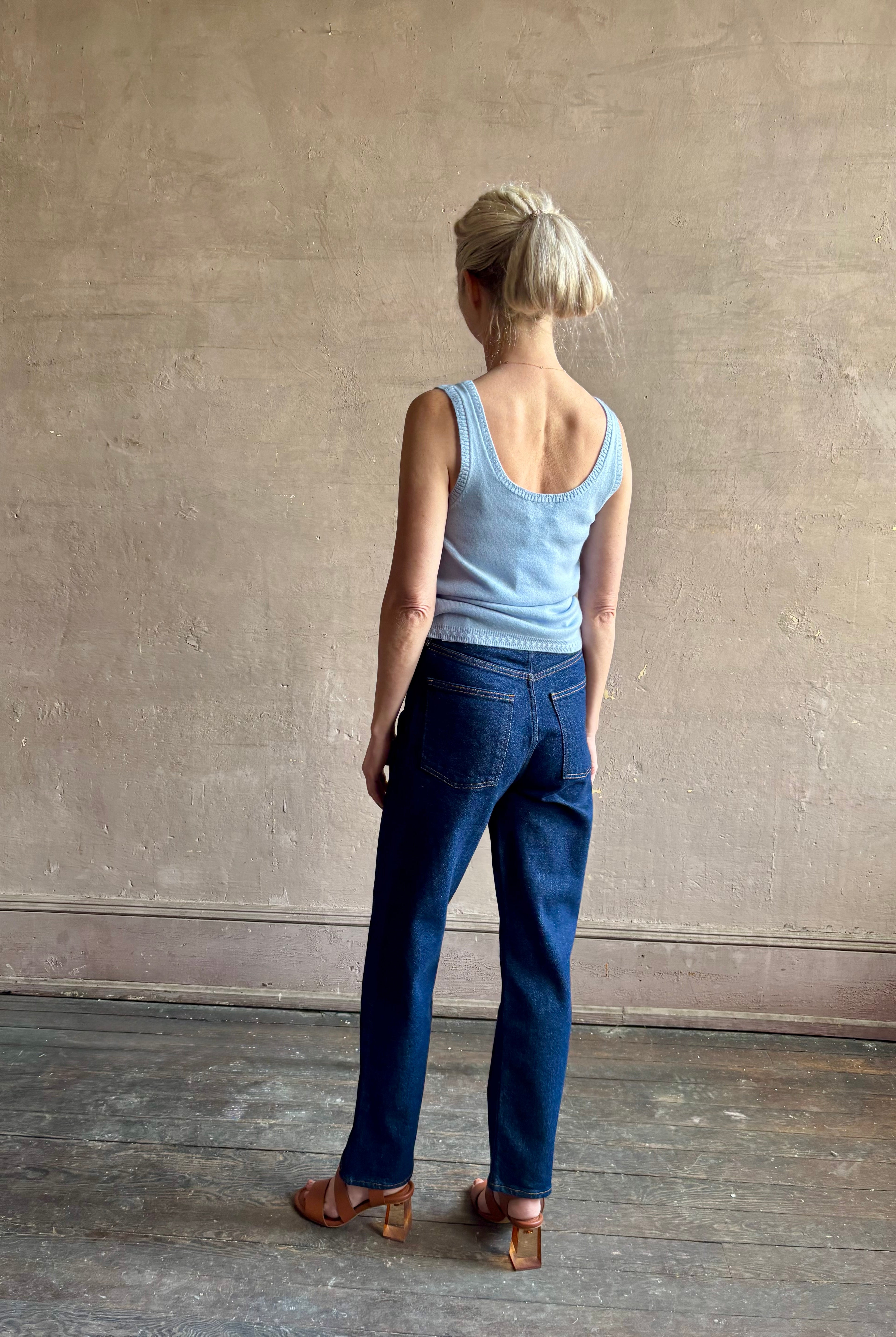 Image of woman wearing luxury cashmere knitwear Tanya Taylor Rory Cashmere Tank top in Pale Blue with a feminine scoop back