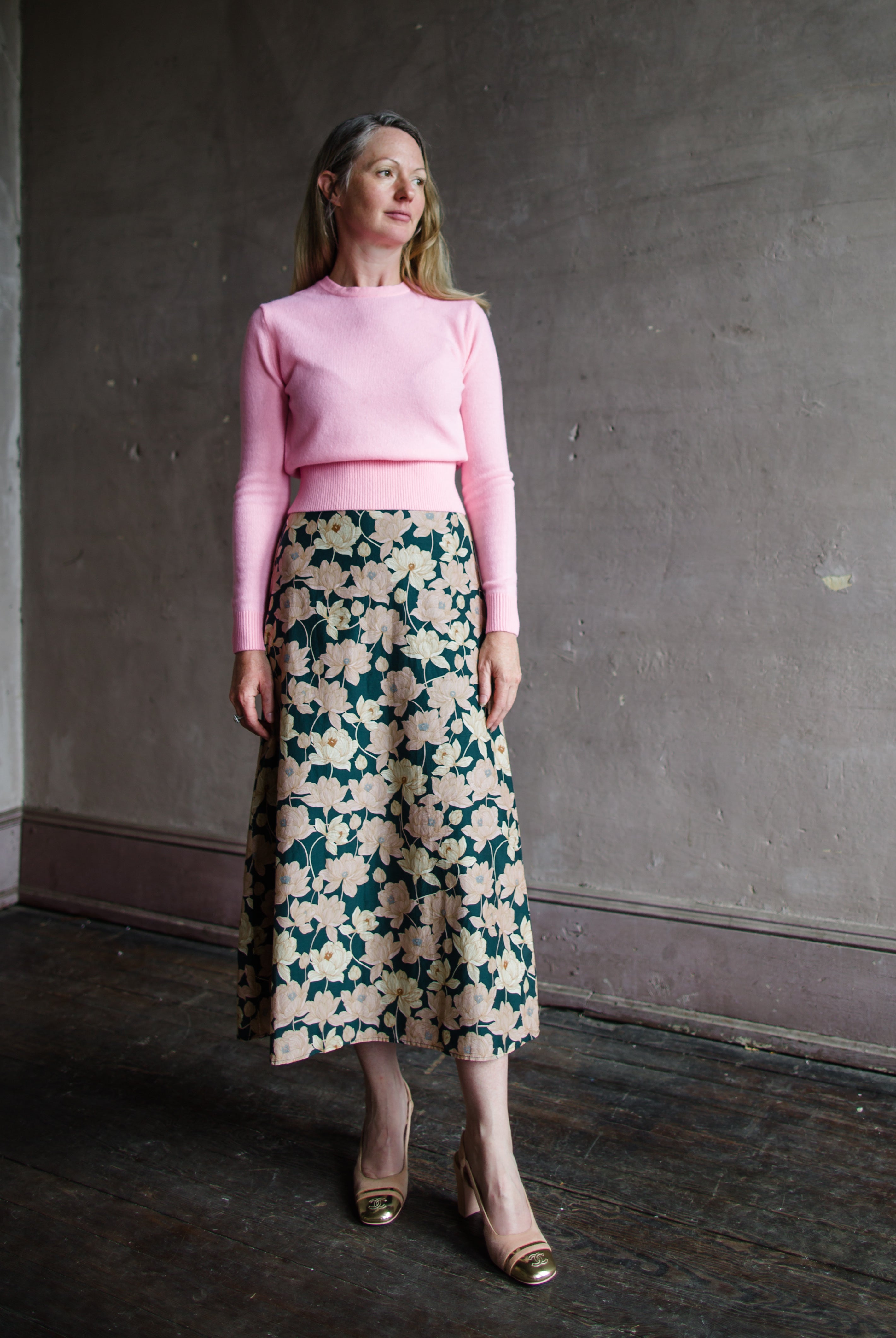 Image featuring a woman wearing the Demi Floral skirt by Trovata with a high rise and a-line fit in a beautiful floral pattern.