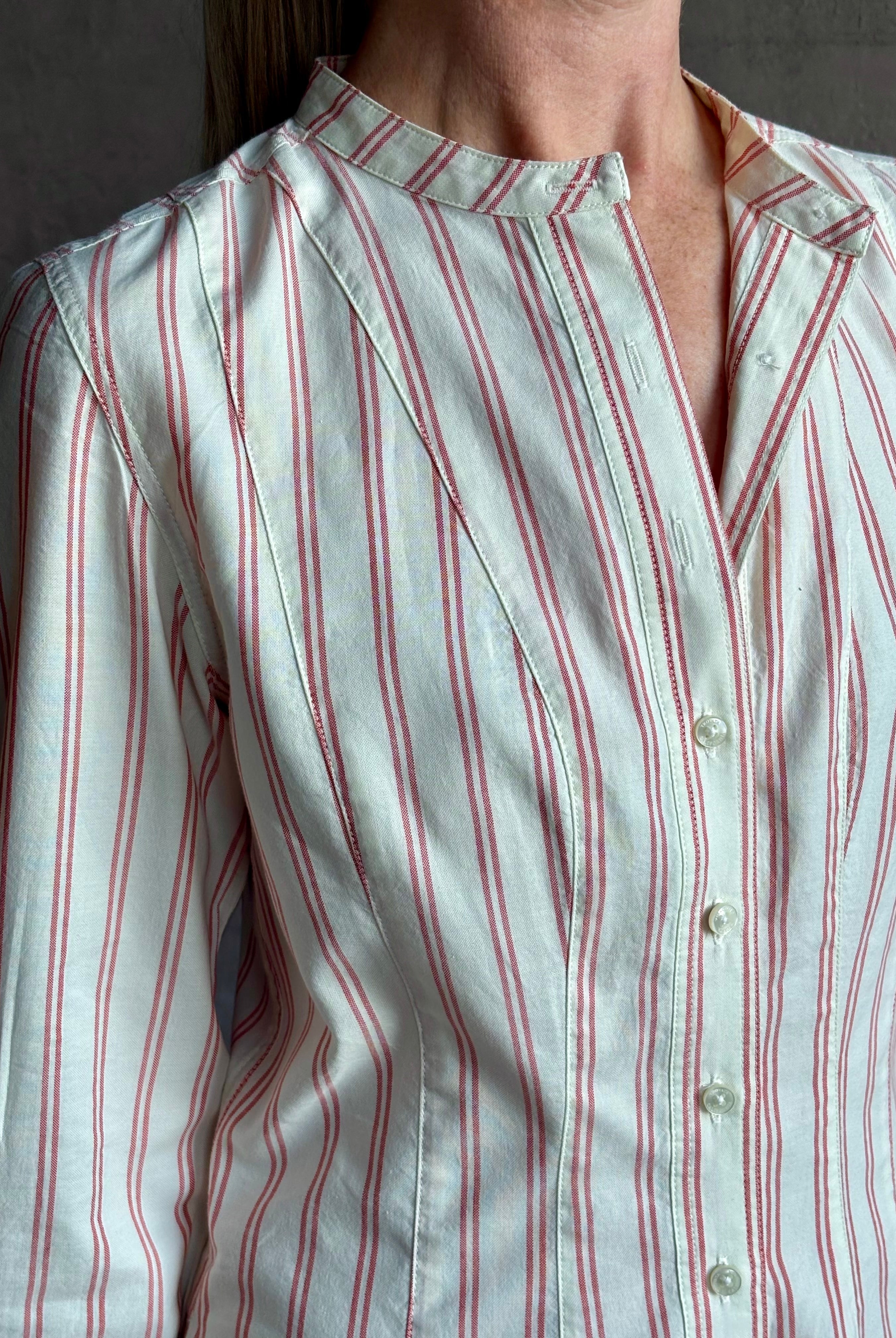 Woman wearing elevated casual wear Trovata Marina cotton shirt Dress in cream and red Stripe with mandarin collar, long sleeves, pockets and expert tailoring