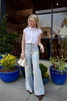 Mature model wearing luxury brand TWP white cap sleeve top with detachable crystal beaded collar in premium cotton