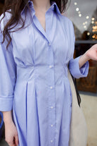 Close Up image of a woman wearing the luxury brand TWP M Dress in oxford blue premium cotton
