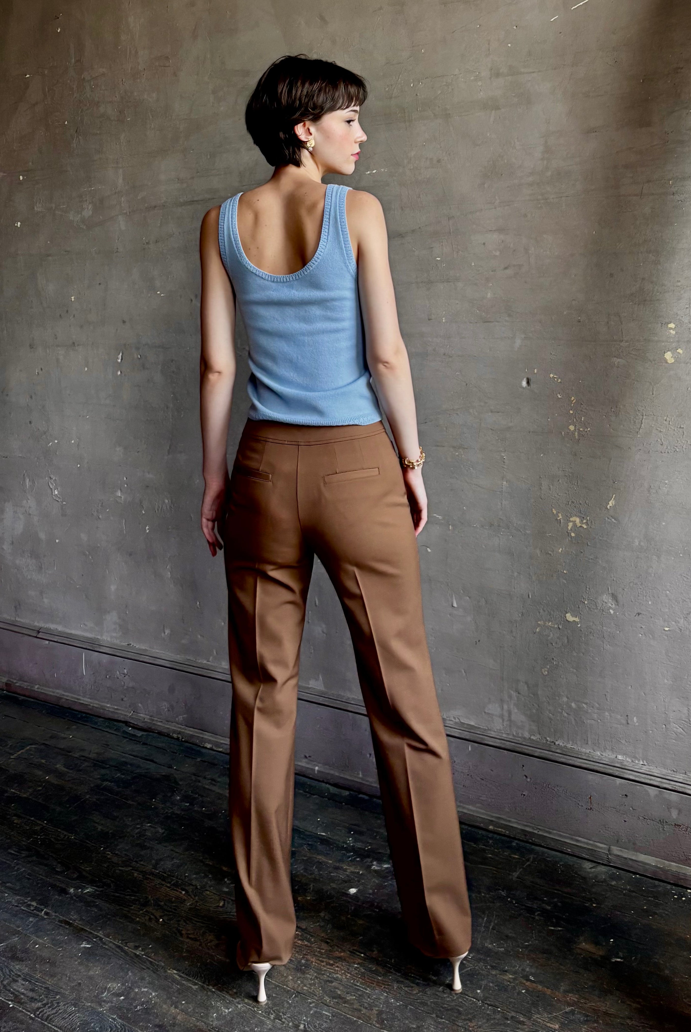 Woman wearing premium wool tailored blanca trousers by luxury designer Ulla Johnson neutral warm brown