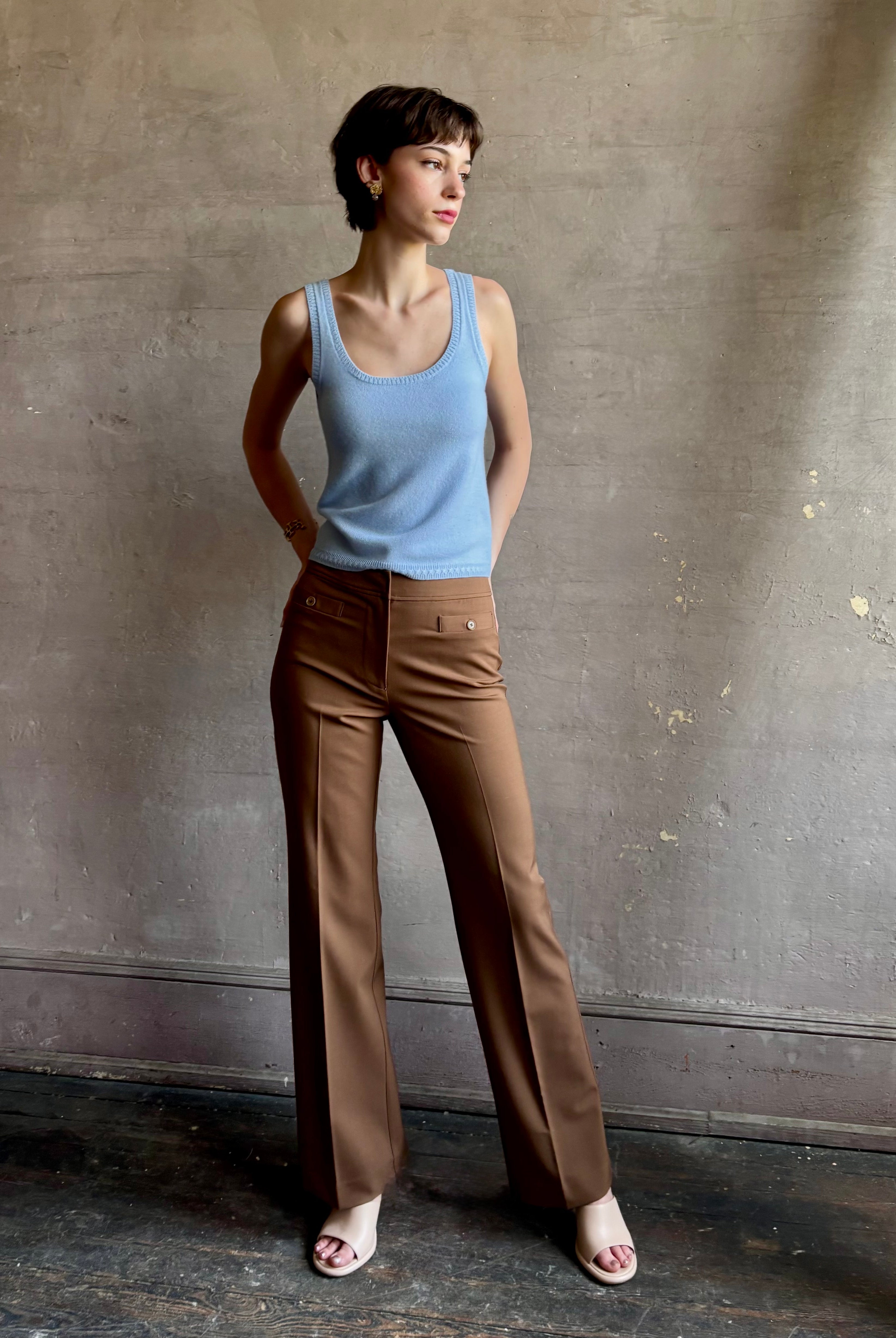 Woman wearing premium wool tailored blanca trousers by luxury designer Ulla Johnson neutral warm brown