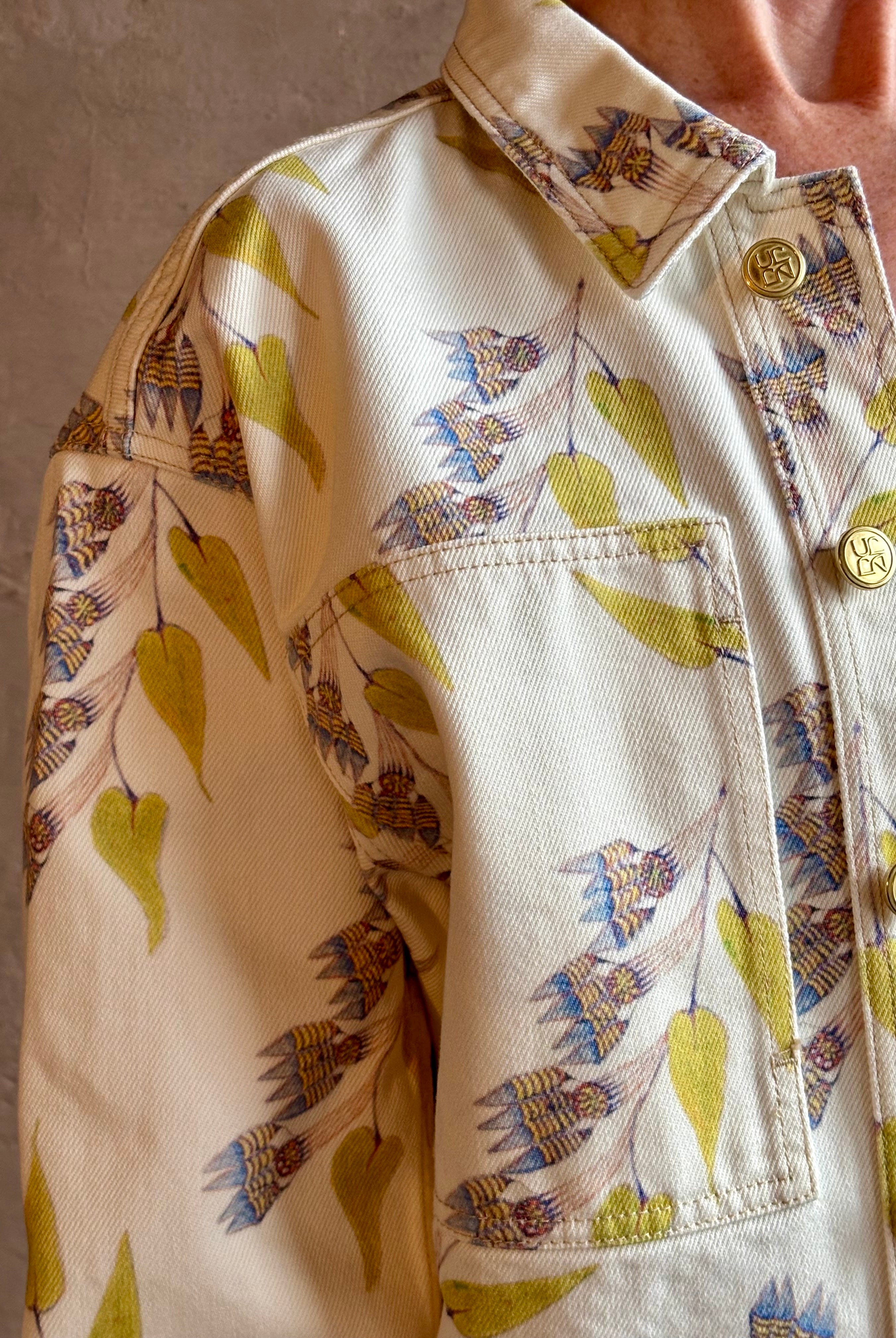 Woman wearing designer ULLA JOHNSON Bobbi denim Jacket in an artisan collaboration print Infinite Flower