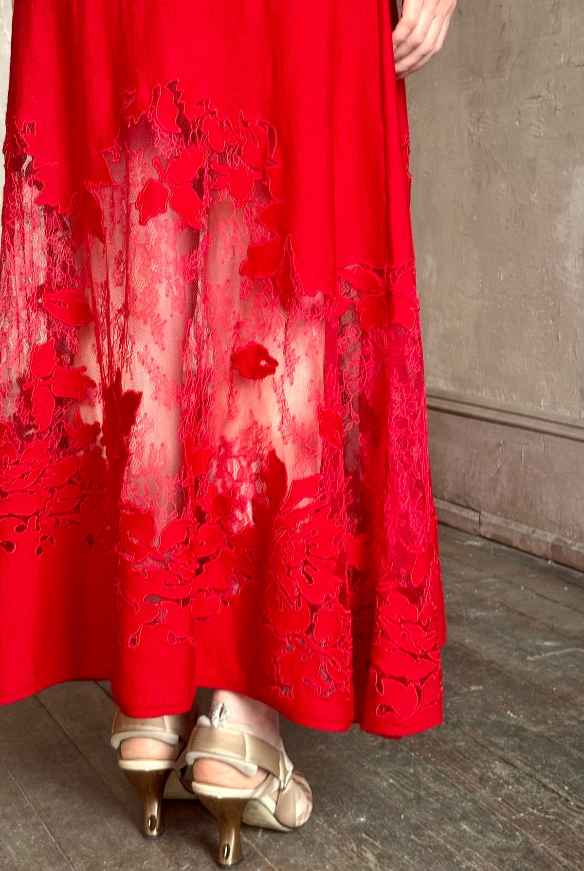 Mature woman wearing designer Ulla Johnson's Clemence LS Lace Dress in Cerise red virgin wool knit with delicate lace hemline