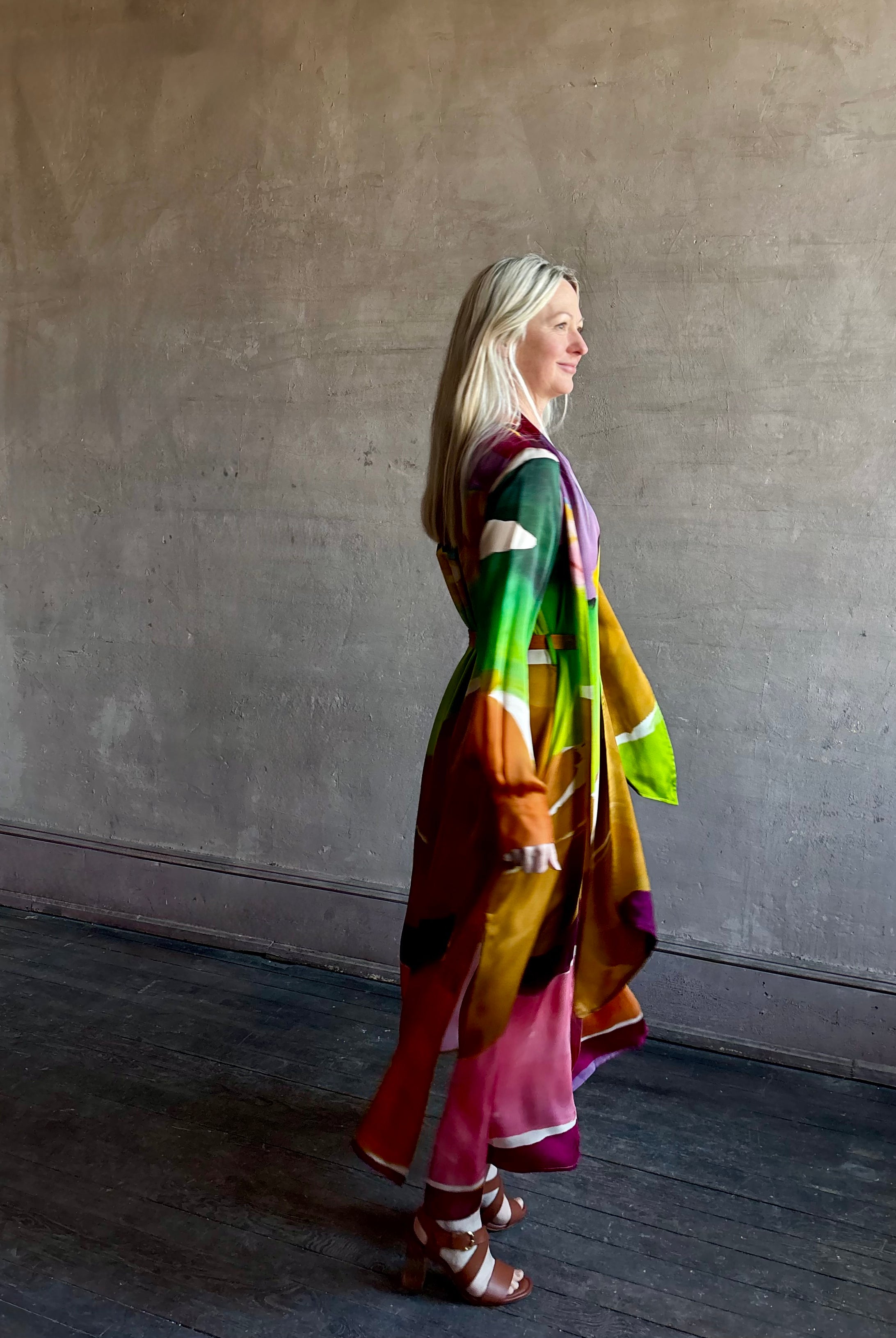 Woman wearing the Critique Long Sleeve fluid Silk maxi Dress from Ulla Johnson in wearable art abstract print via a collaboration with American painter Helen Frankenthaler