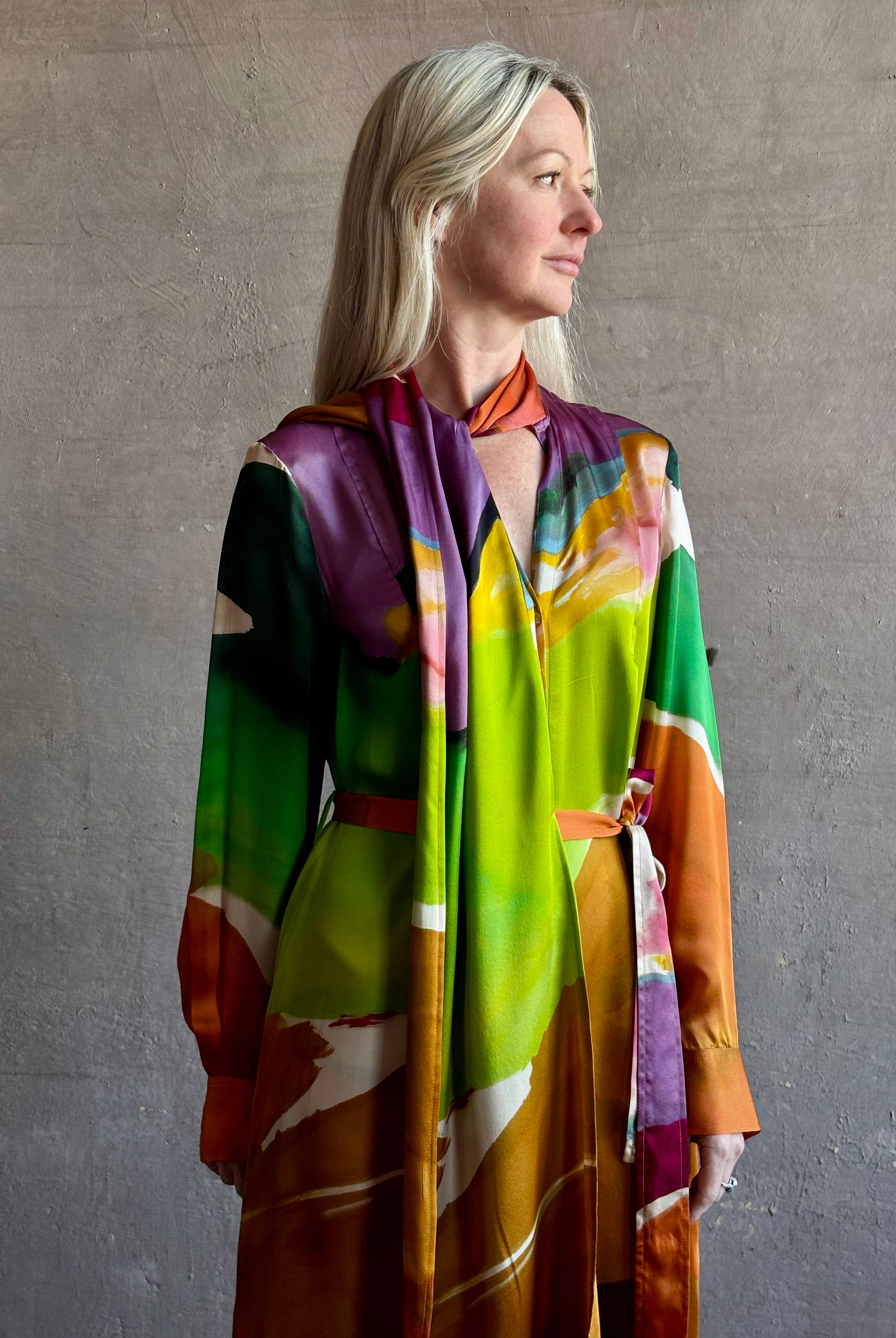 Woman wearing the Critique Long Sleeve fluid Silk maxi Dress from Ulla Johnson in wearable art abstract print via a collaboration with American painter Helen Frankenthaler
