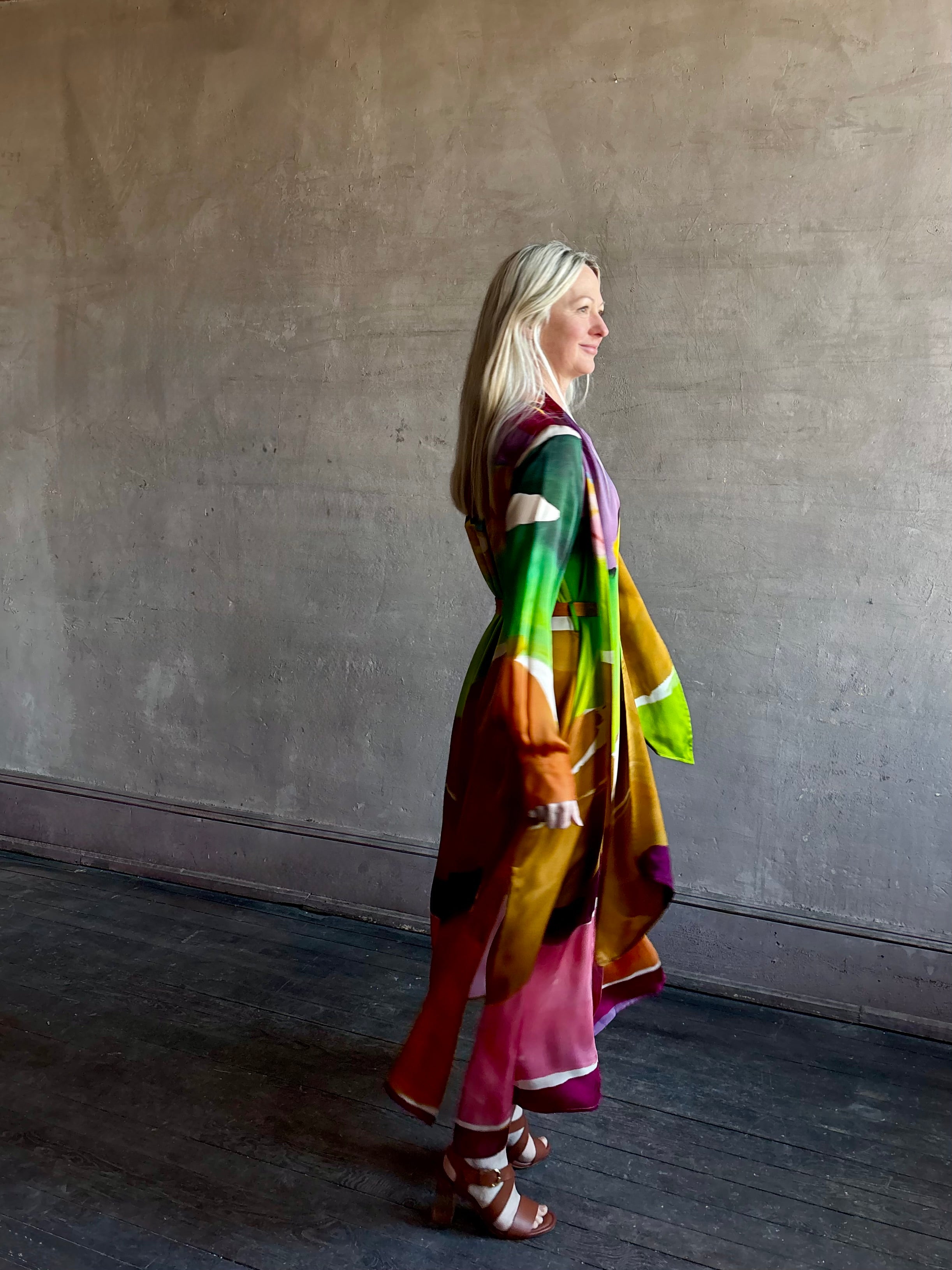 Woman wearing the Critique Long Sleeve fluid Silk maxi Dress from Ulla Johnson in wearable art abstract print via a collaboration with American painter Helen Frankenthaler
