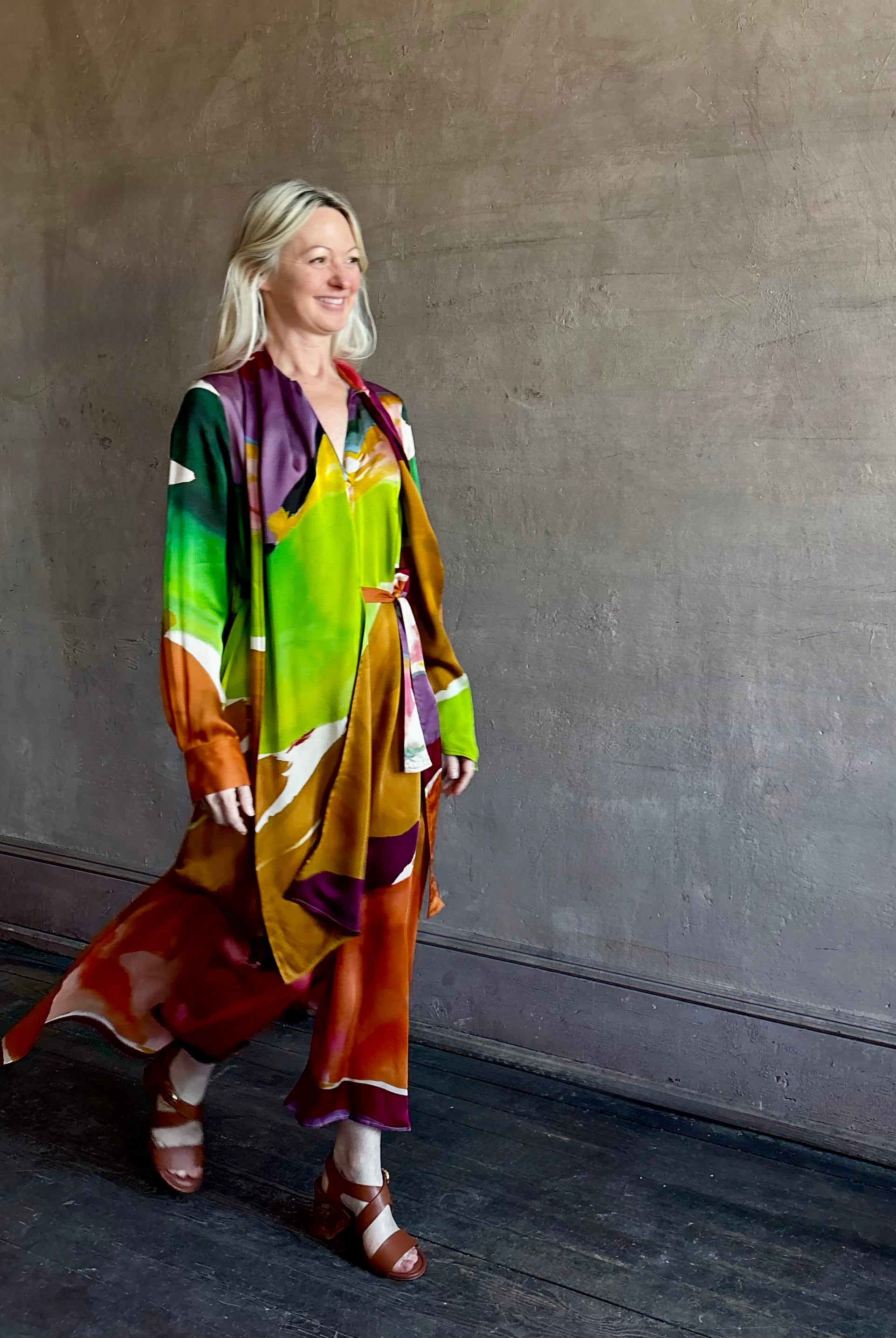 Woman wearing the Critique Long Sleeve fluid Silk maxi Dress from Ulla Johnson in wearable art abstract print via a collaboration with American painter Helen Frankenthaler