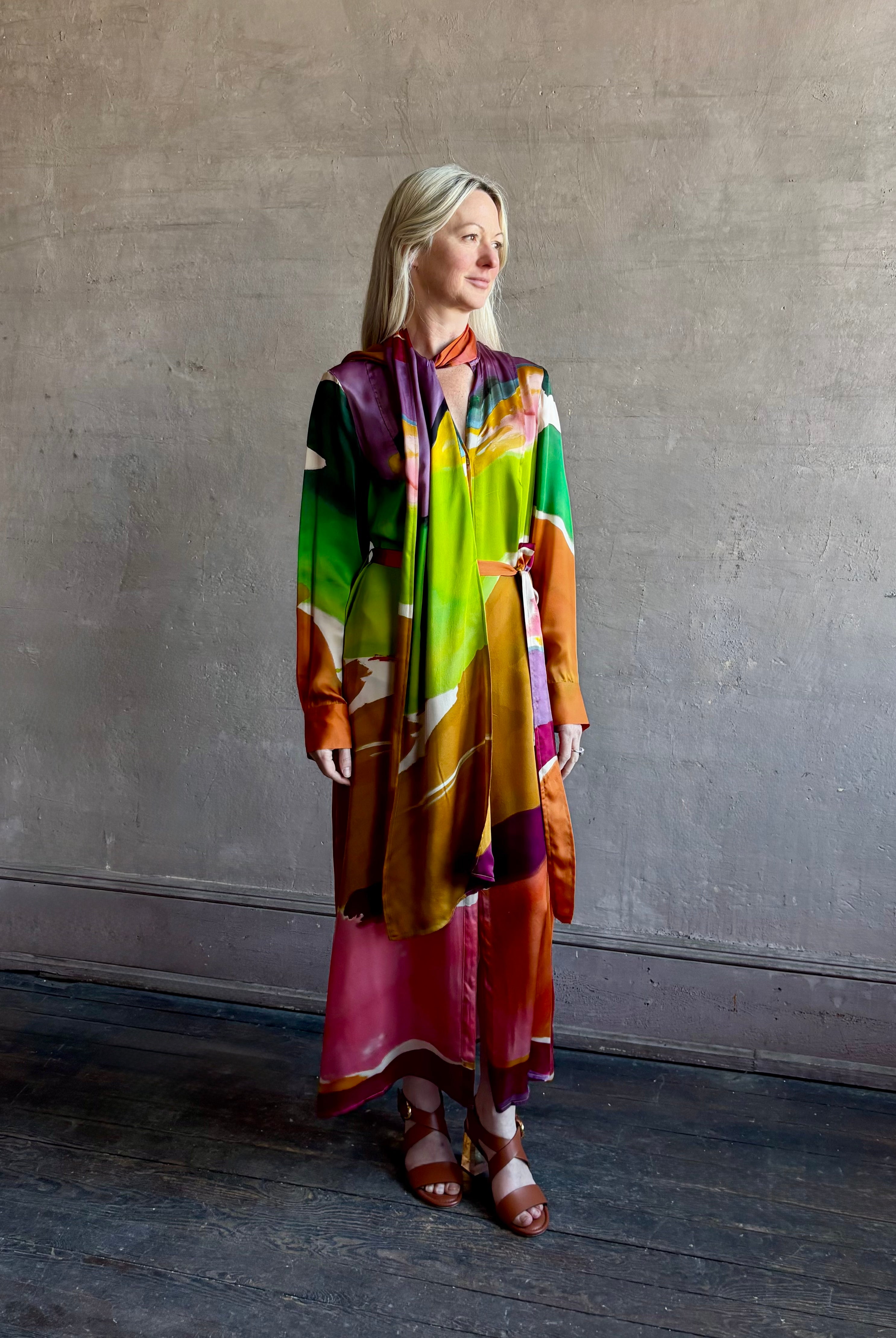 Woman wearing the Critique Long Sleeve fluid Silk maxi Dress from Ulla Johnson in wearable art abstract print via a collaboration with American painter Helen Frankenthaler