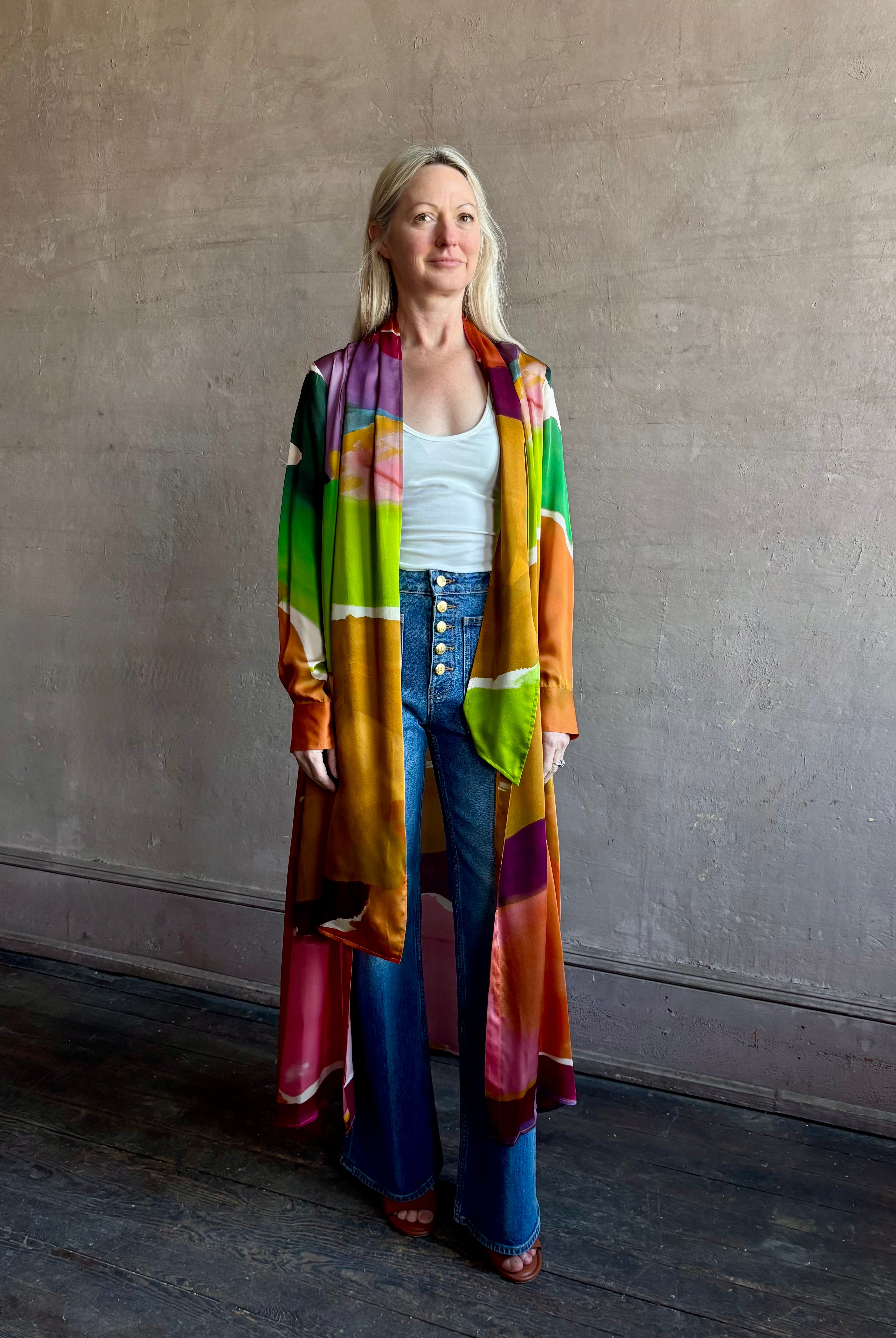 Woman wearing the Critique Long Sleeve fluid Silk maxi Dress from Ulla Johnson in wearable art abstract print via a collaboration with American painter Helen Frankenthaler