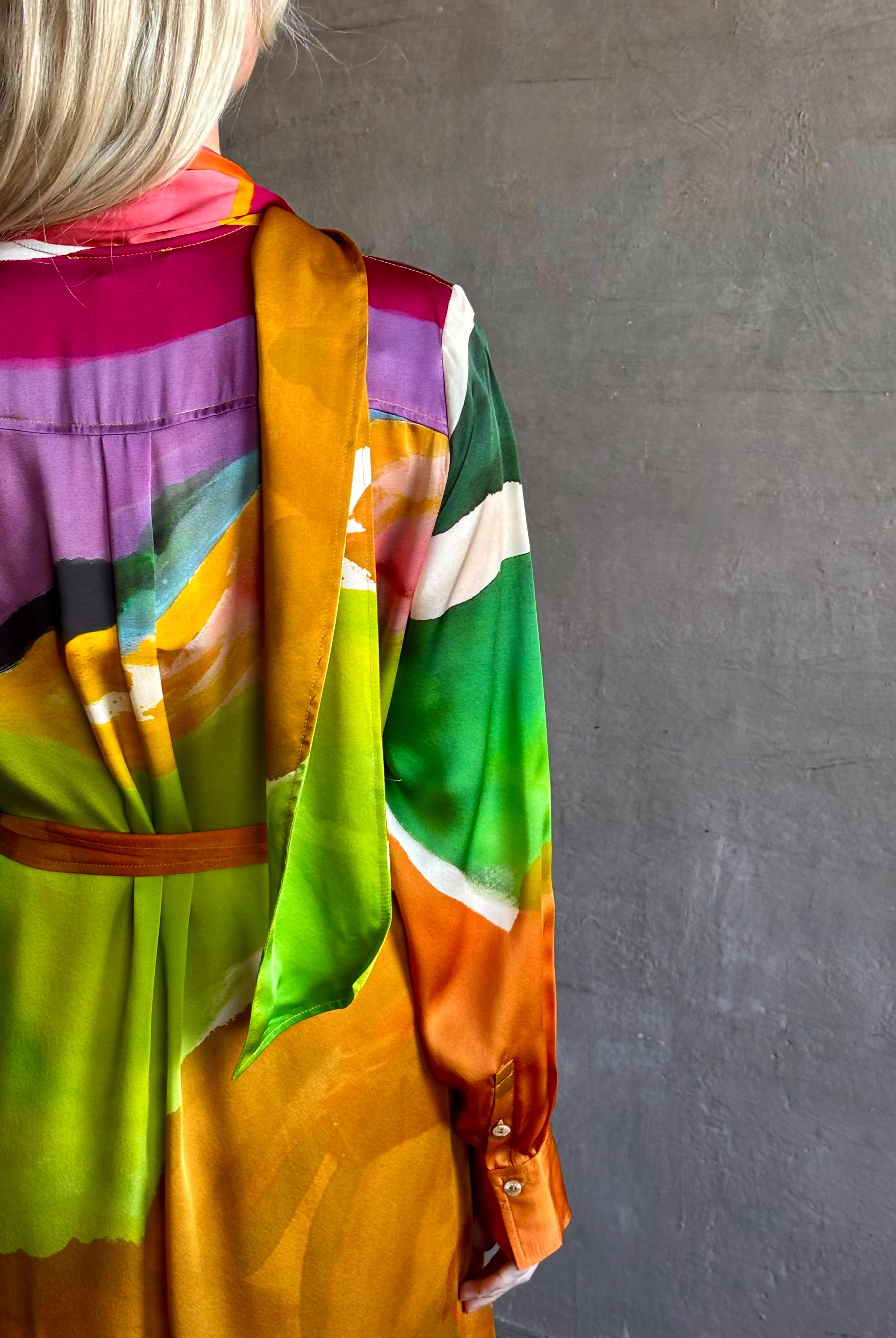 Woman wearing the Critique Long Sleeve fluid Silk maxi Dress from Ulla Johnson in wearable art abstract print via a collaboration with American painter Helen Frankenthaler