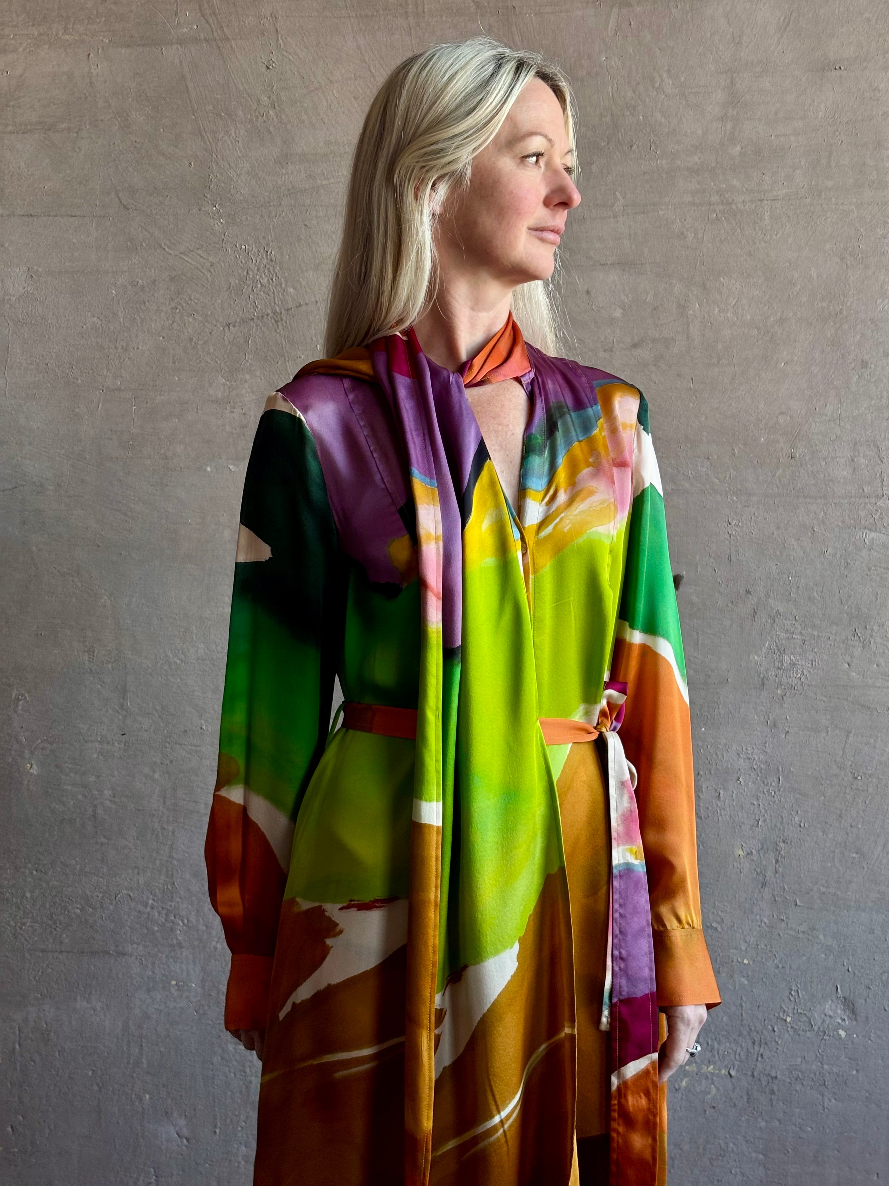 Woman wearing the Critique Long Sleeve fluid Silk maxi Dress from Ulla Johnson in wearable art abstract print via a collaboration with American painter Helen Frankenthaler