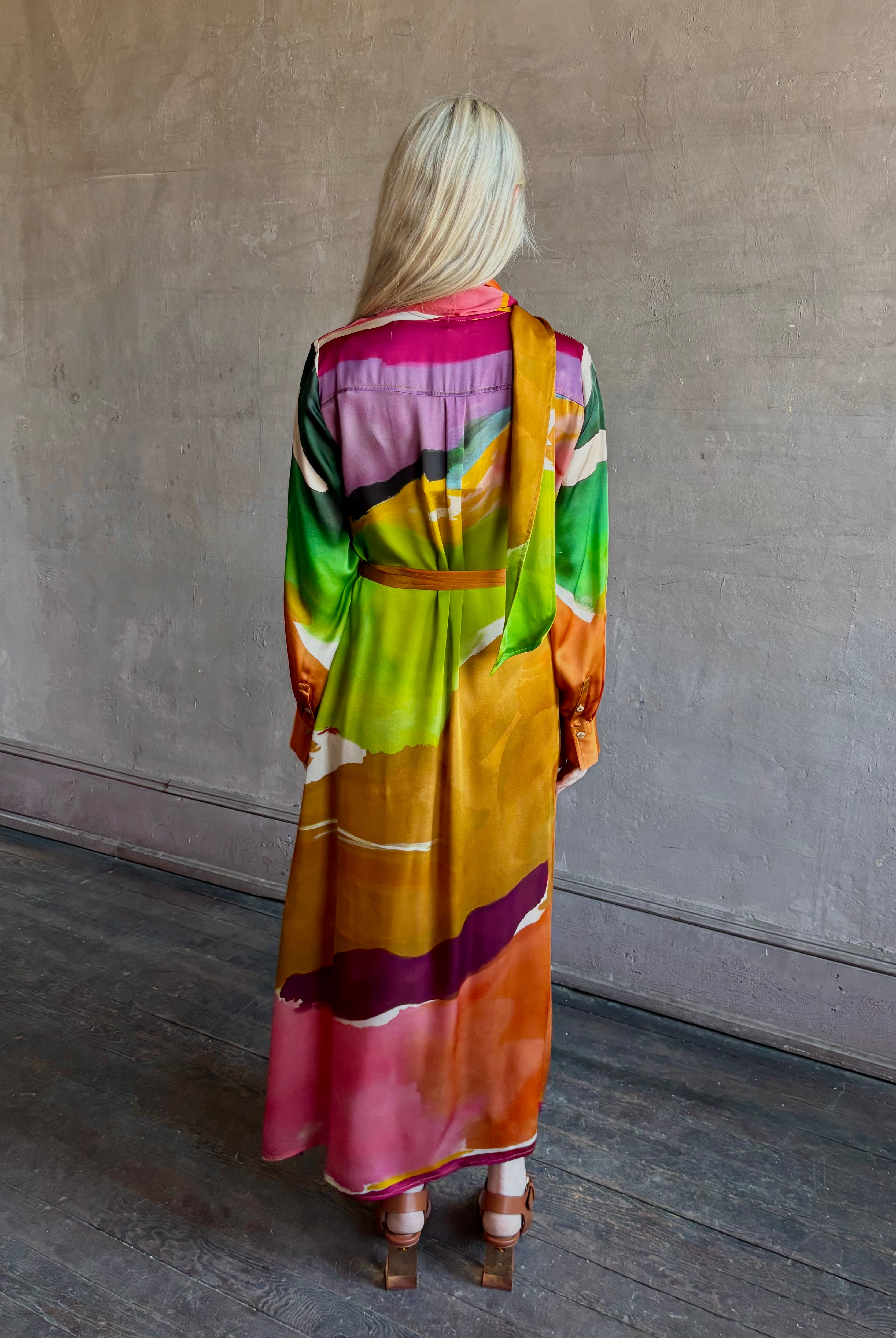 Woman wearing the Critique Long Sleeve fluid Silk maxi Dress from Ulla Johnson in wearable art abstract print via a collaboration with American painter Helen Frankenthaler