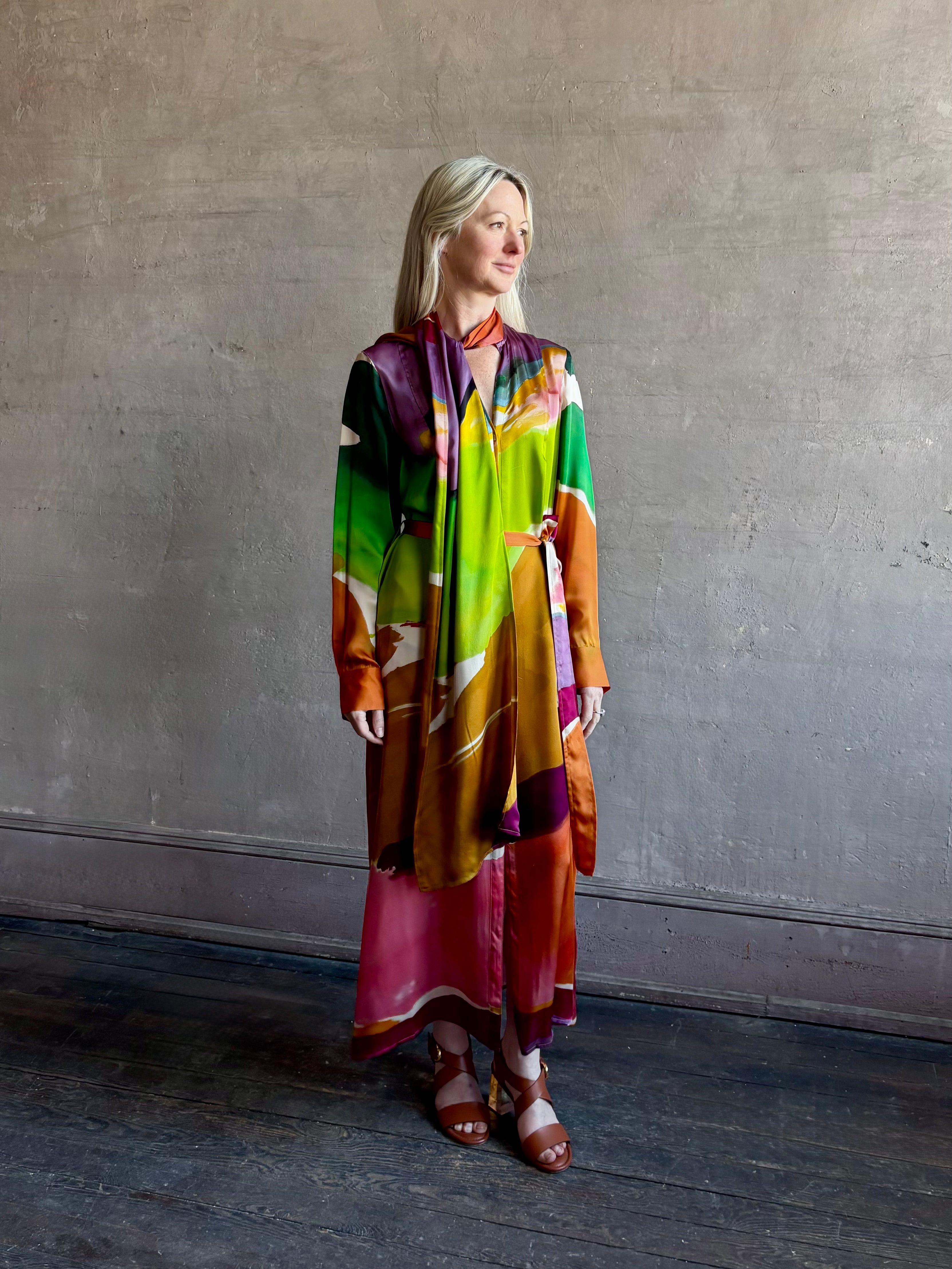 Woman wearing the Critique Long Sleeve fluid Silk maxi Dress from Ulla Johnson in wearable art abstract print via a collaboration with American painter Helen Frankenthaler