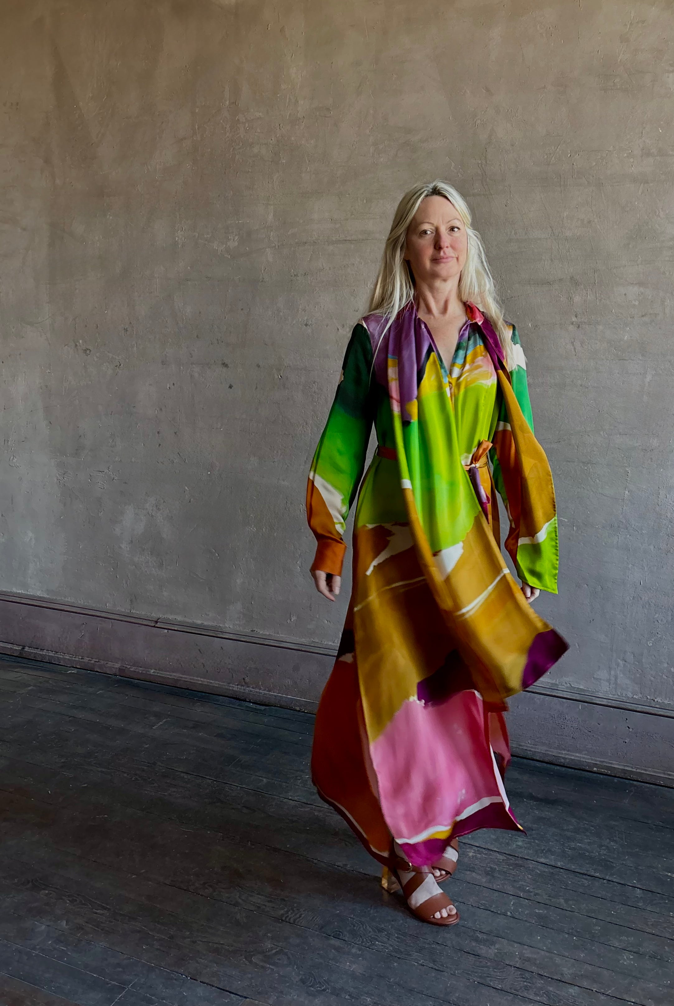 Woman wearing the Critique Long Sleeve fluid Silk maxi Dress from Ulla Johnson in wearable art abstract print via a collaboration with American painter Helen Frankenthaler